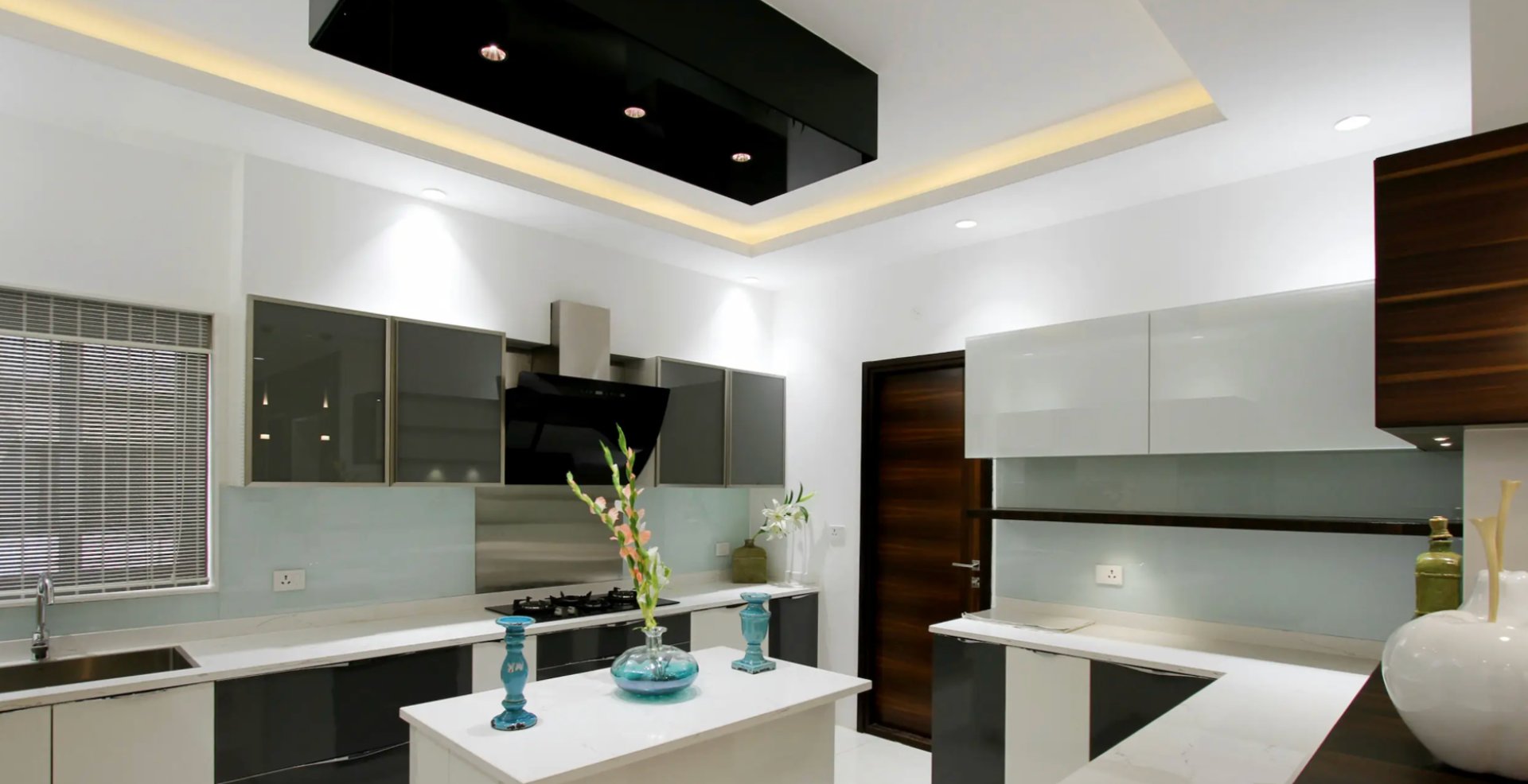 A backyard with a deck and a fence