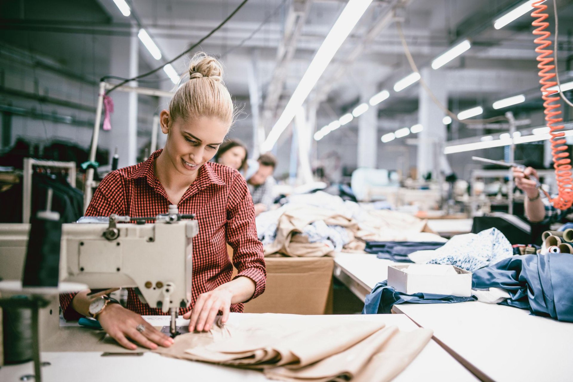 an abstract photo of a curved building with a blue sky in the background