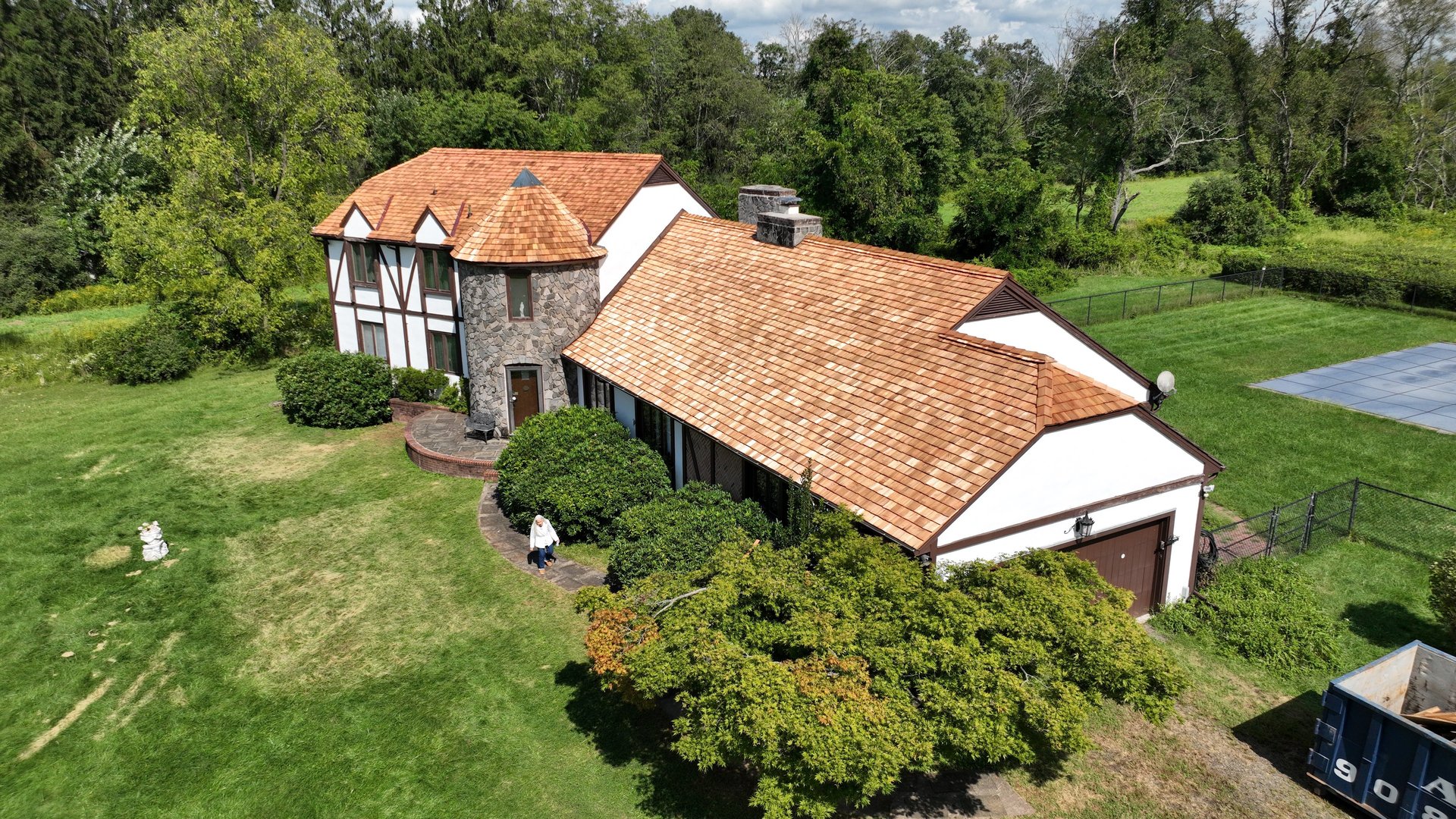 woman wearing yellow long-sleeved dress under white clouds and blue sky during daytime