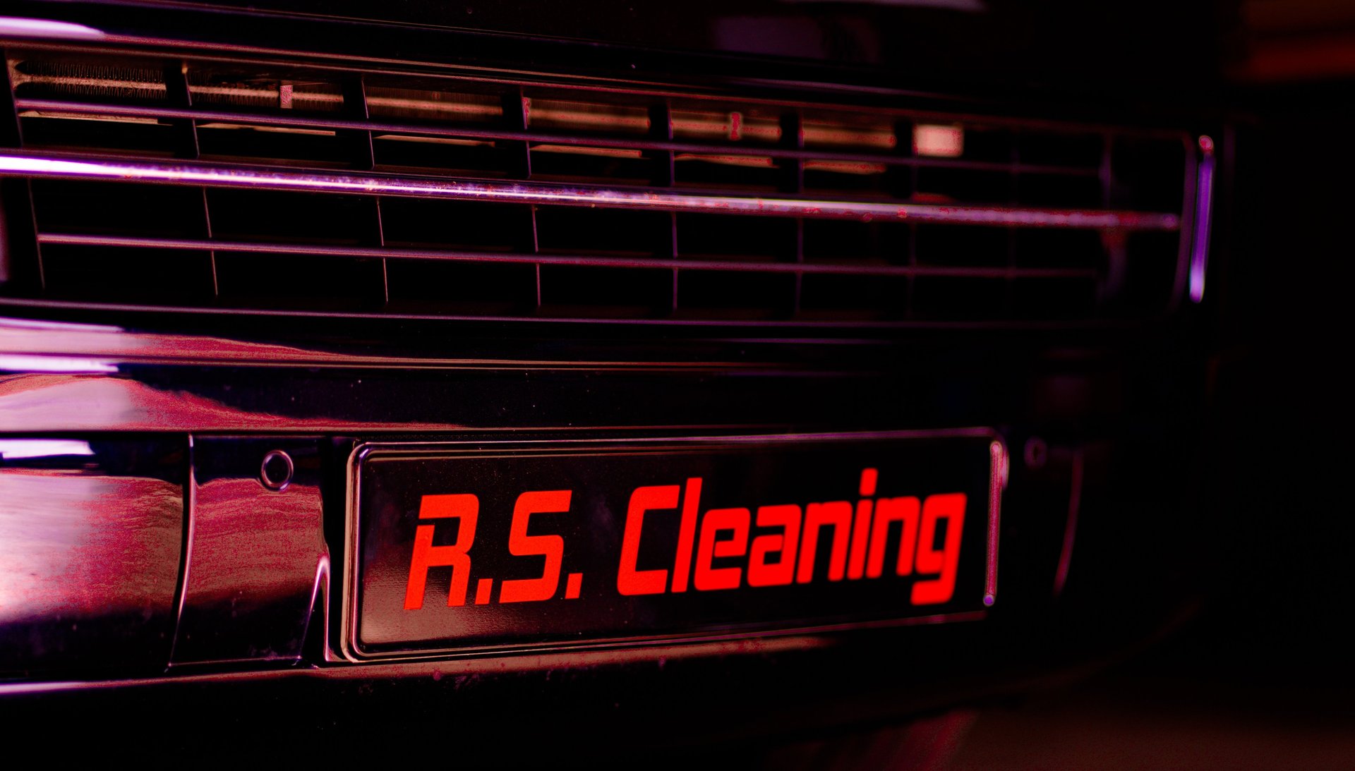 several vehicles parked beside wall