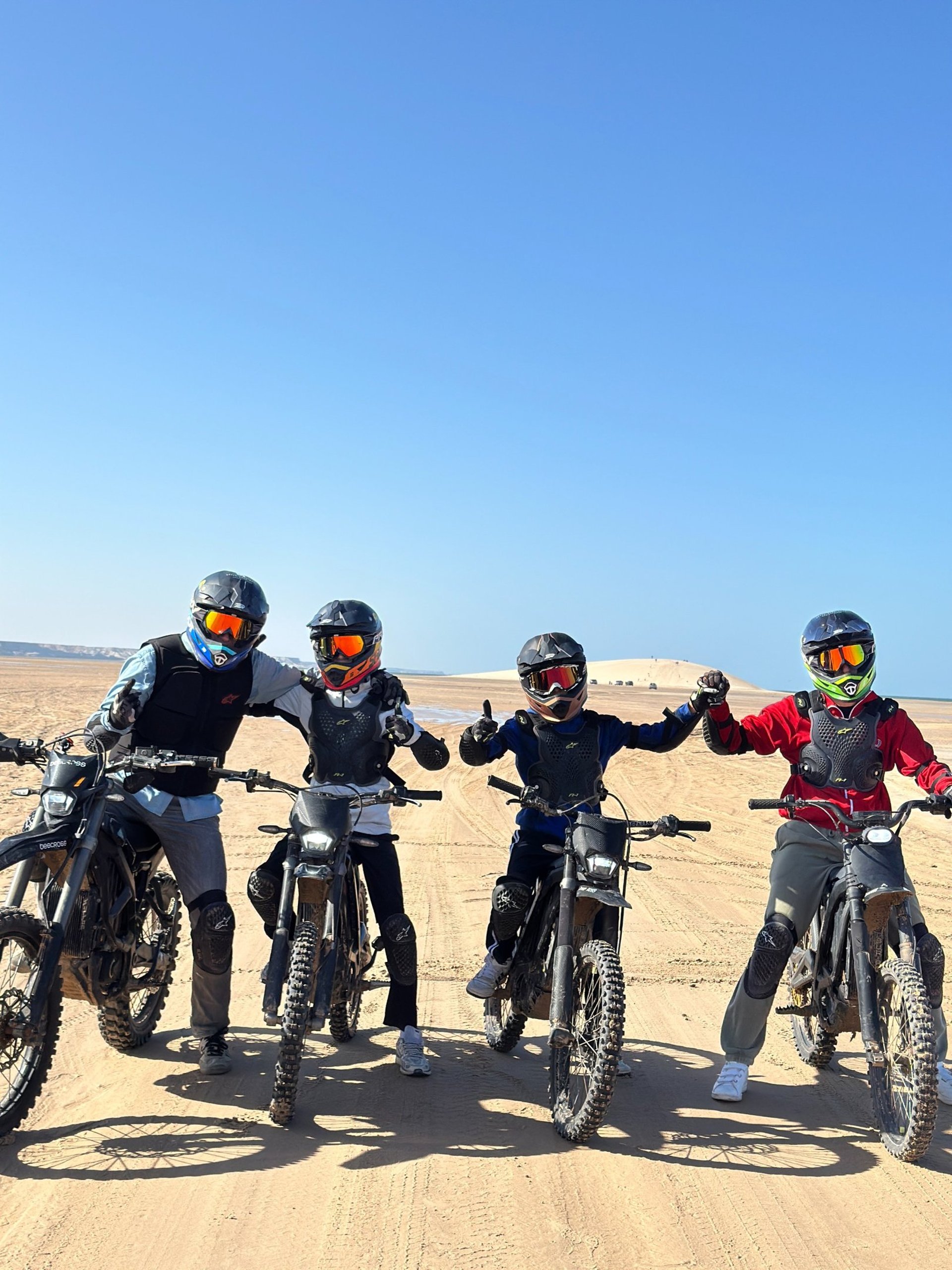 white and brown concrete building near green grass field during daytime
