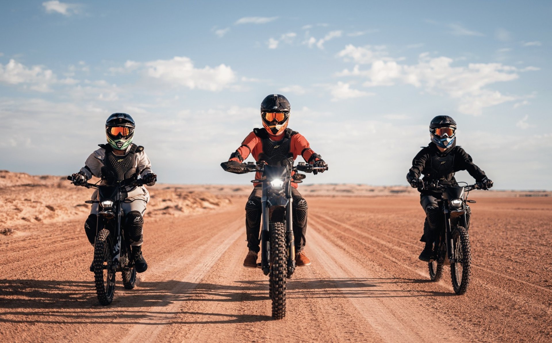 white and brown concrete building near green grass field during daytime