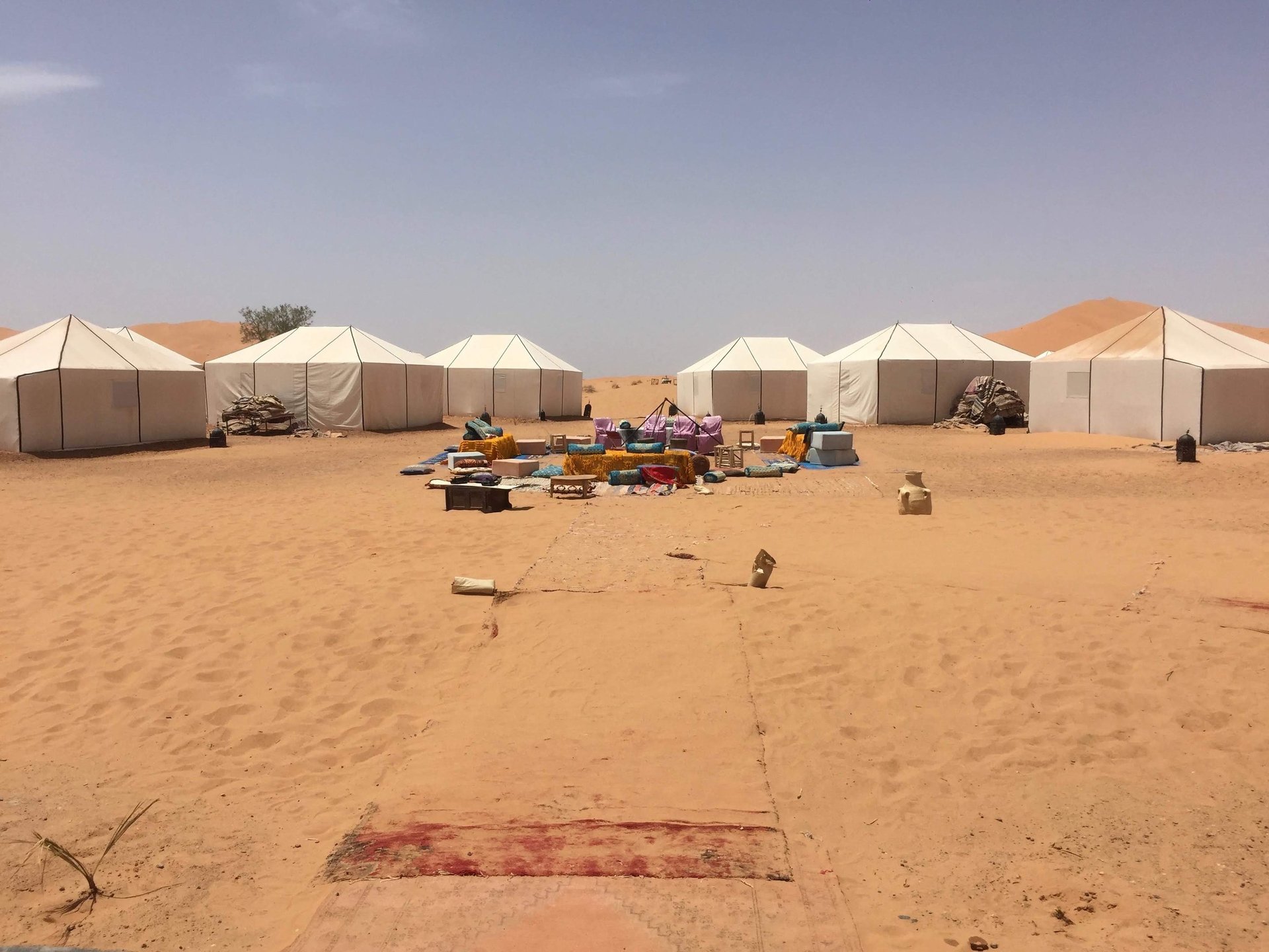white and brown concrete building near green grass field during daytime