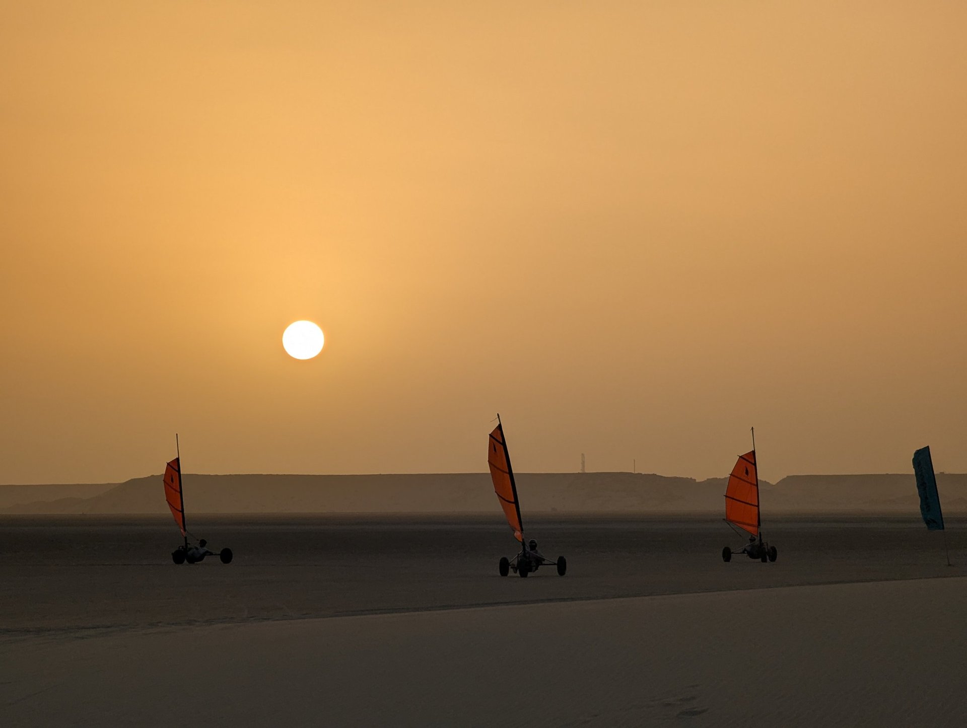 white and brown concrete building near green grass field during daytime