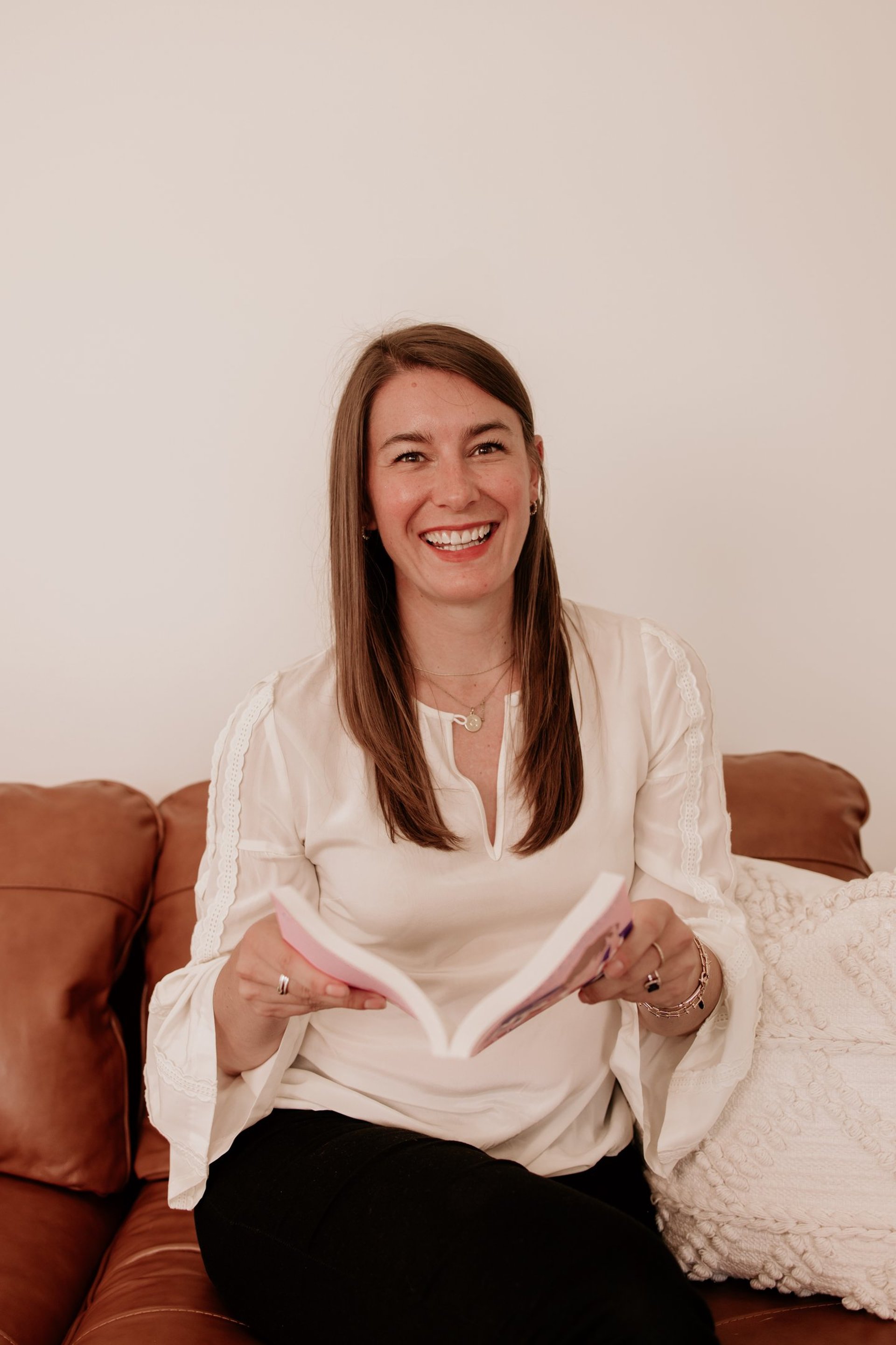 stack of books on white table