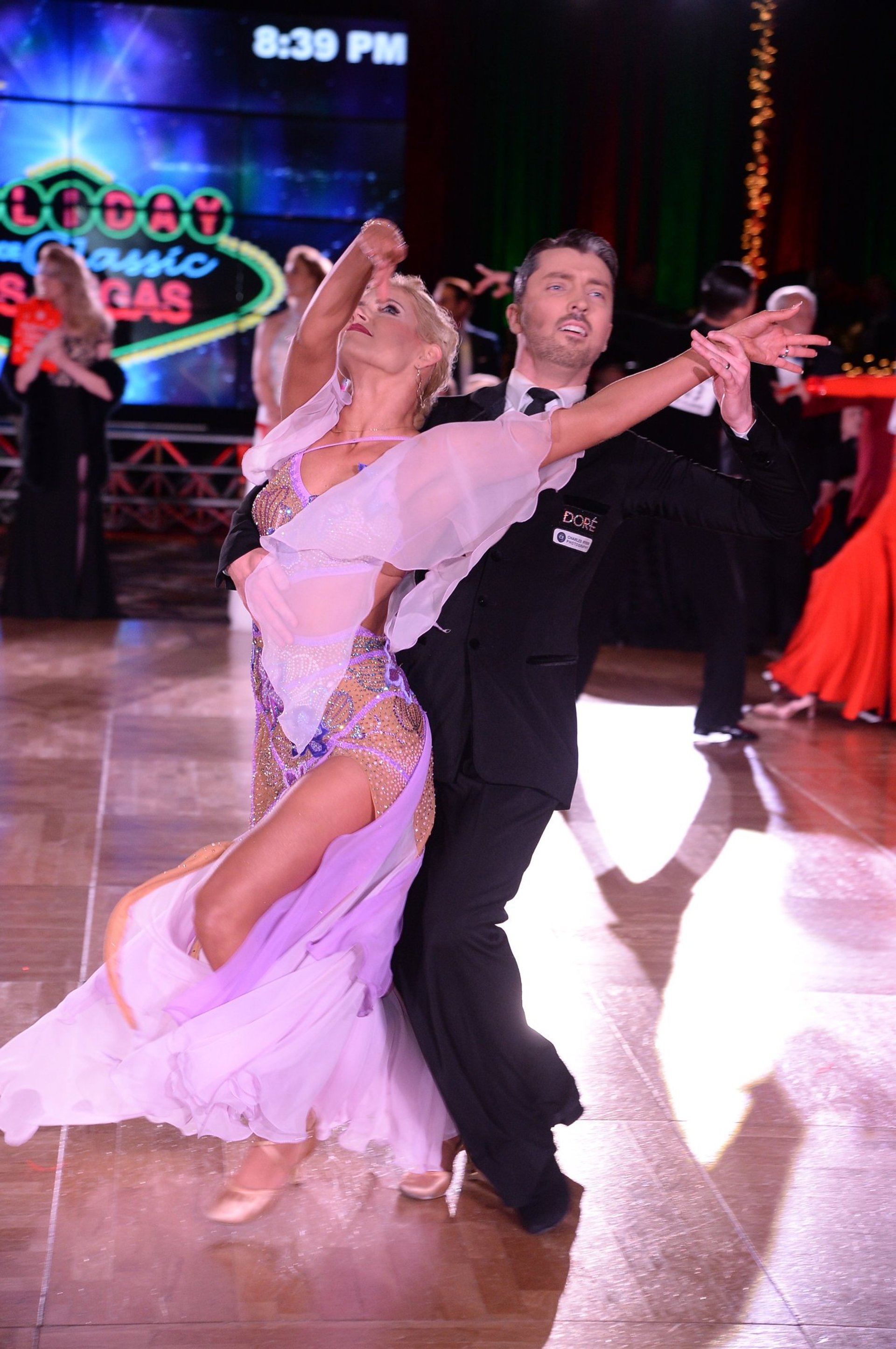 woman wearing yellow long-sleeved dress under white clouds and blue sky during daytime