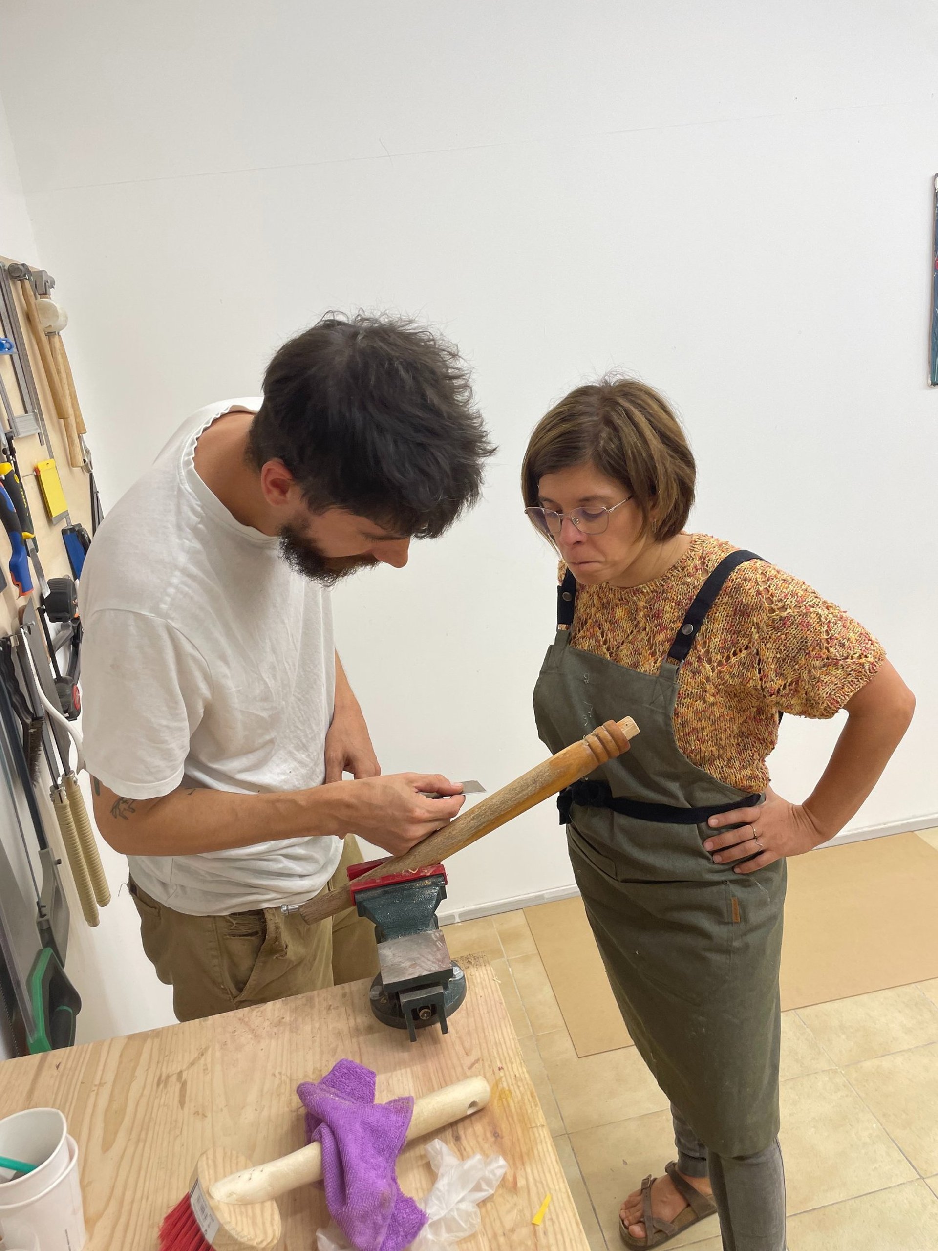 an abstract photo of a curved building with a blue sky in the background