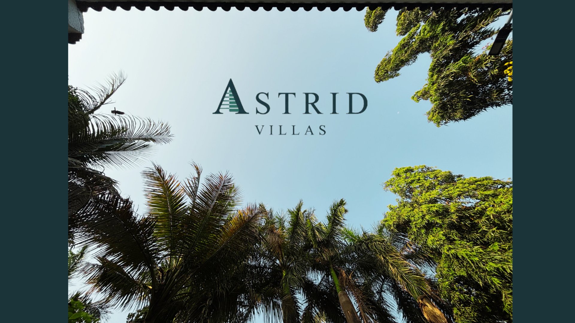 a view of a lush green yard with a bridge in the background