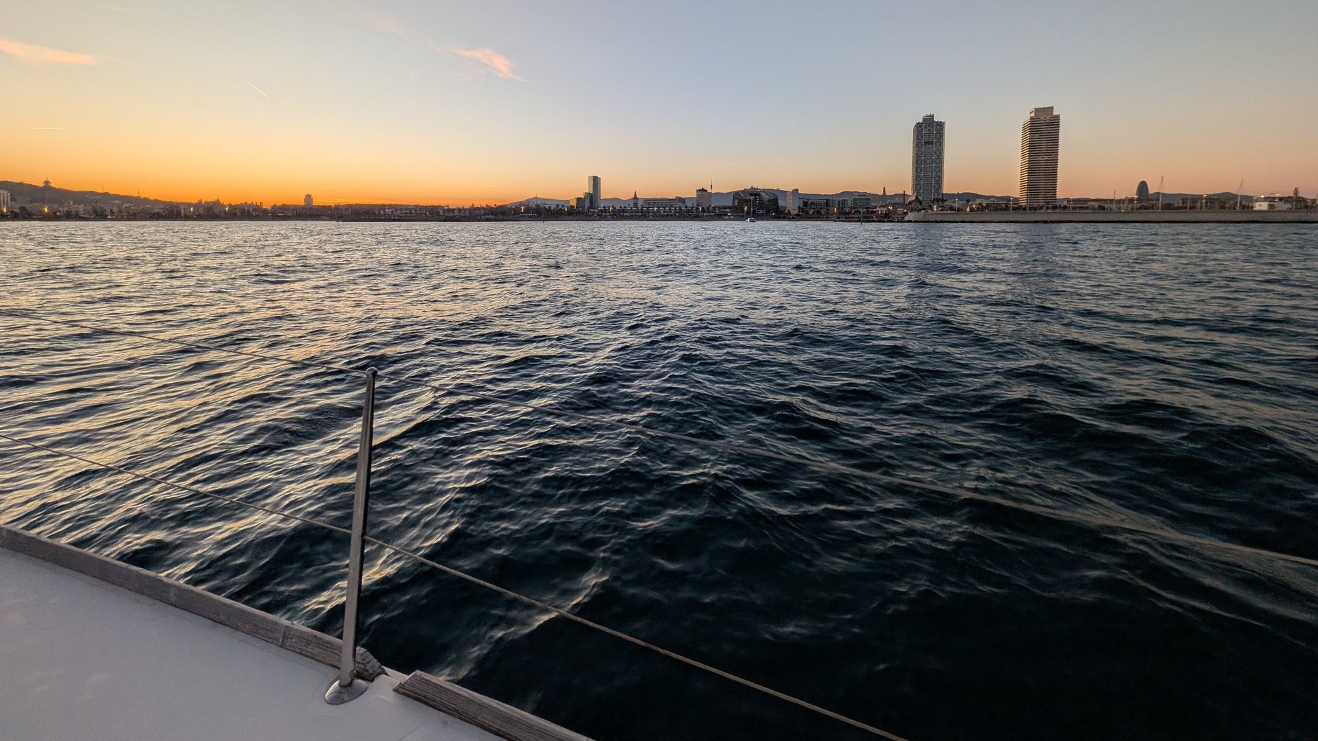 a large body of water with a city in the background