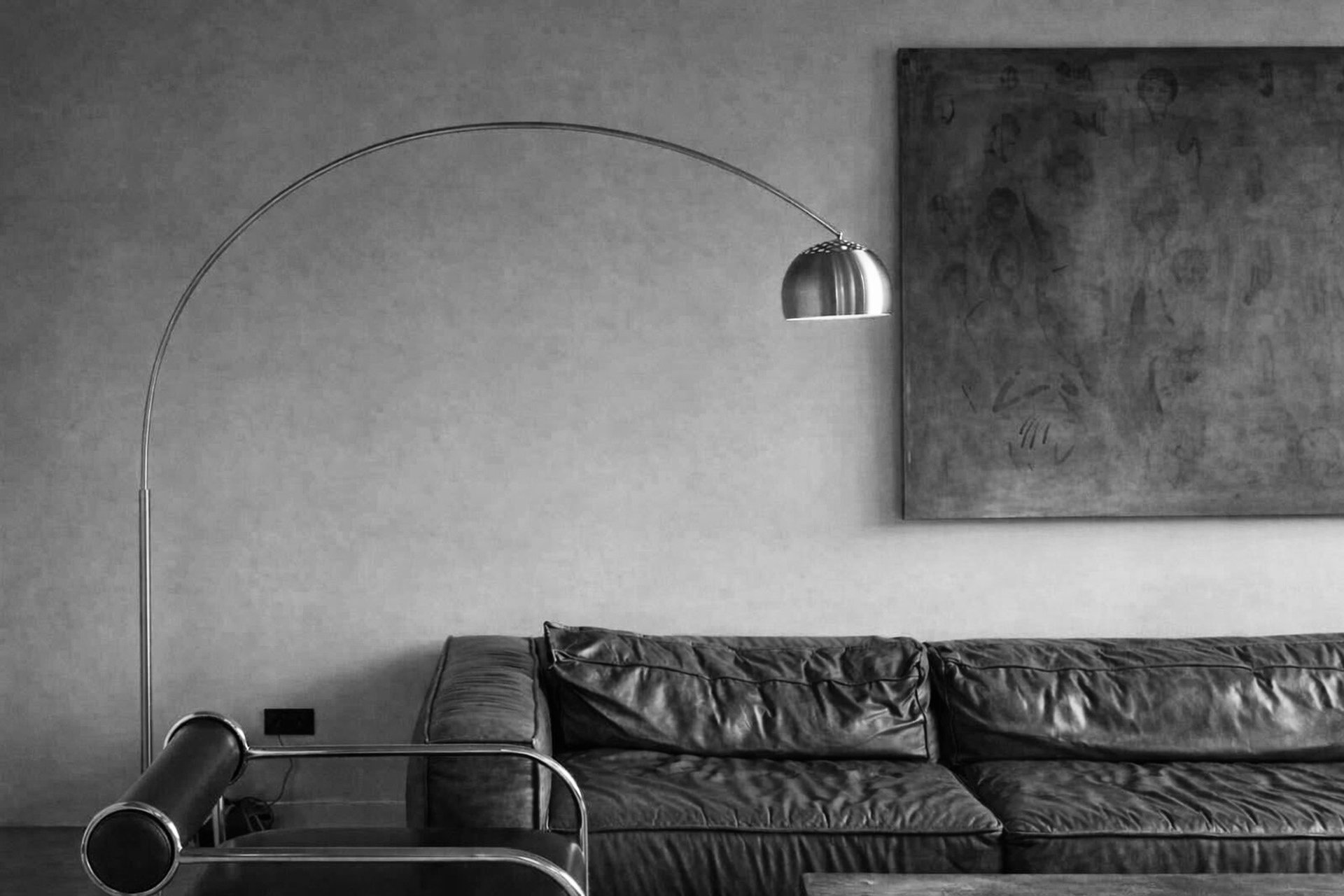 black and brown leather padded tub sofa