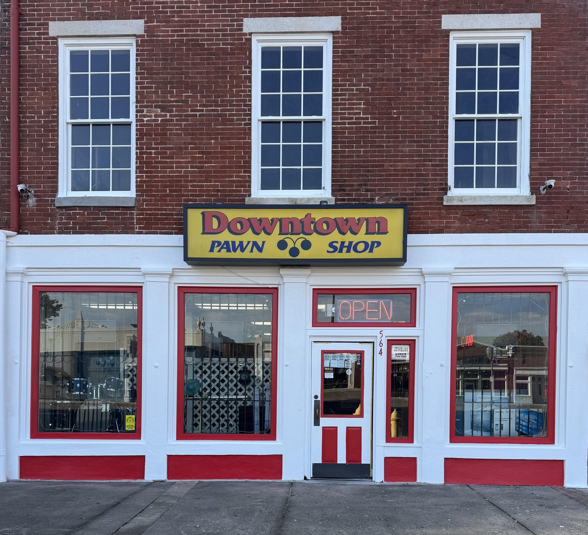woman wearing yellow long-sleeved dress under white clouds and blue sky during daytime