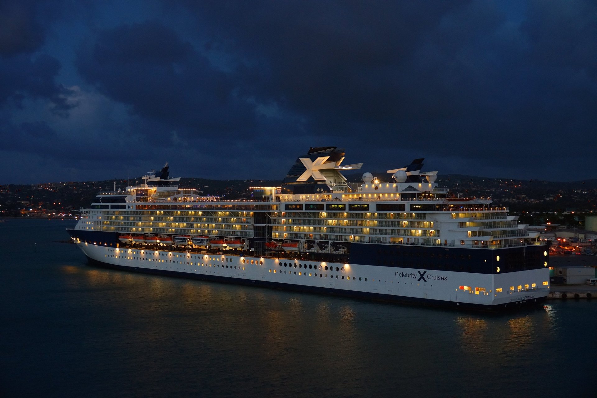 A large cruise ship sails on the ocean.
