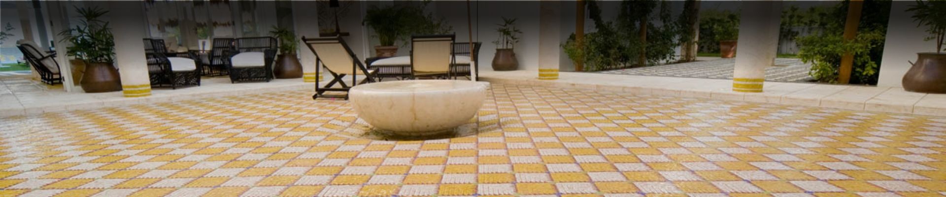 an abstract photo of a curved building with a blue sky in the background