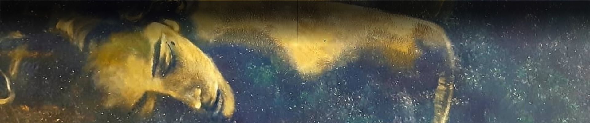 an abstract photo of a curved building with a blue sky in the background