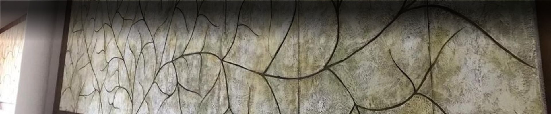 an abstract photo of a curved building with a blue sky in the background