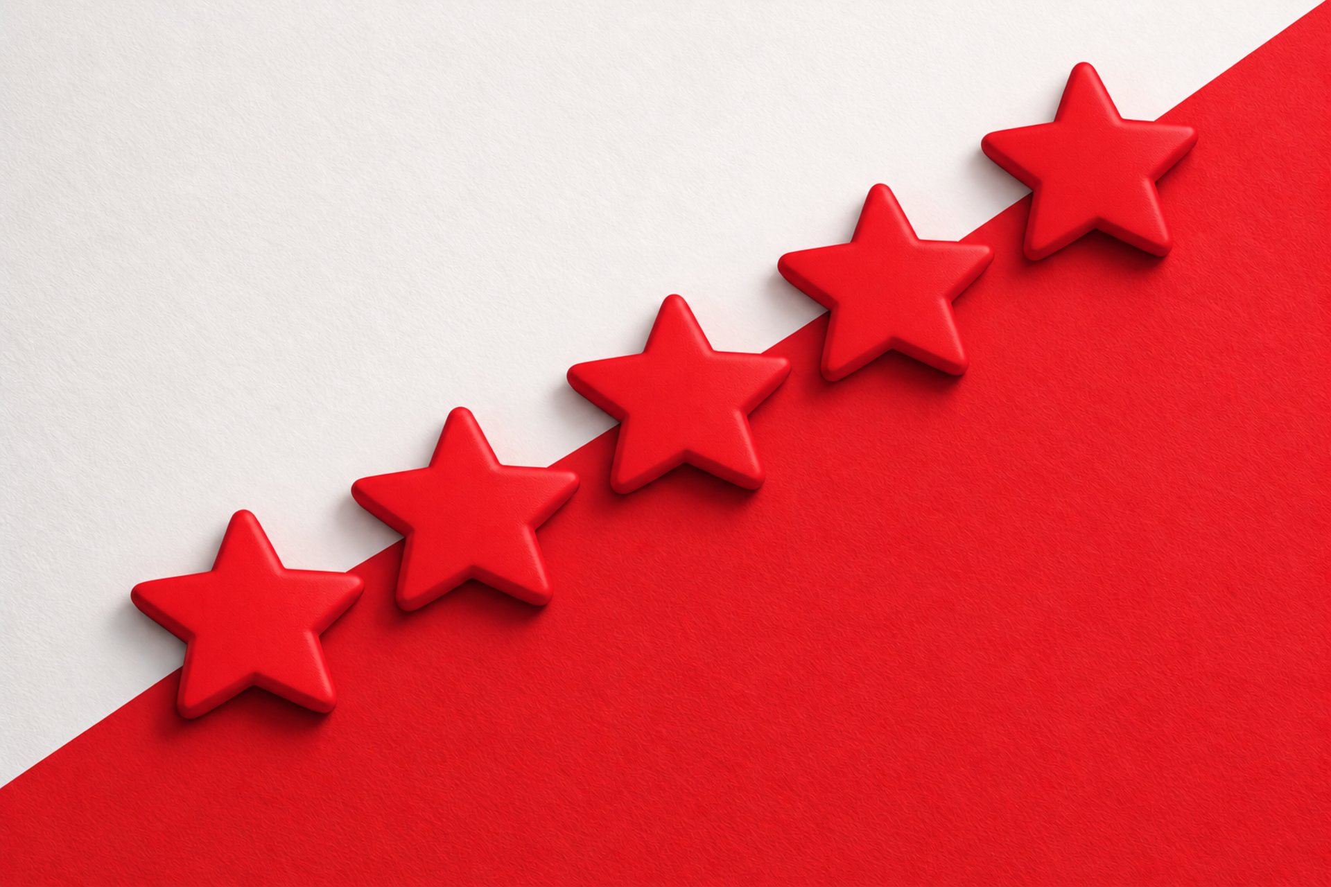 a row of yellow stars sitting on top of a blue and pink surface