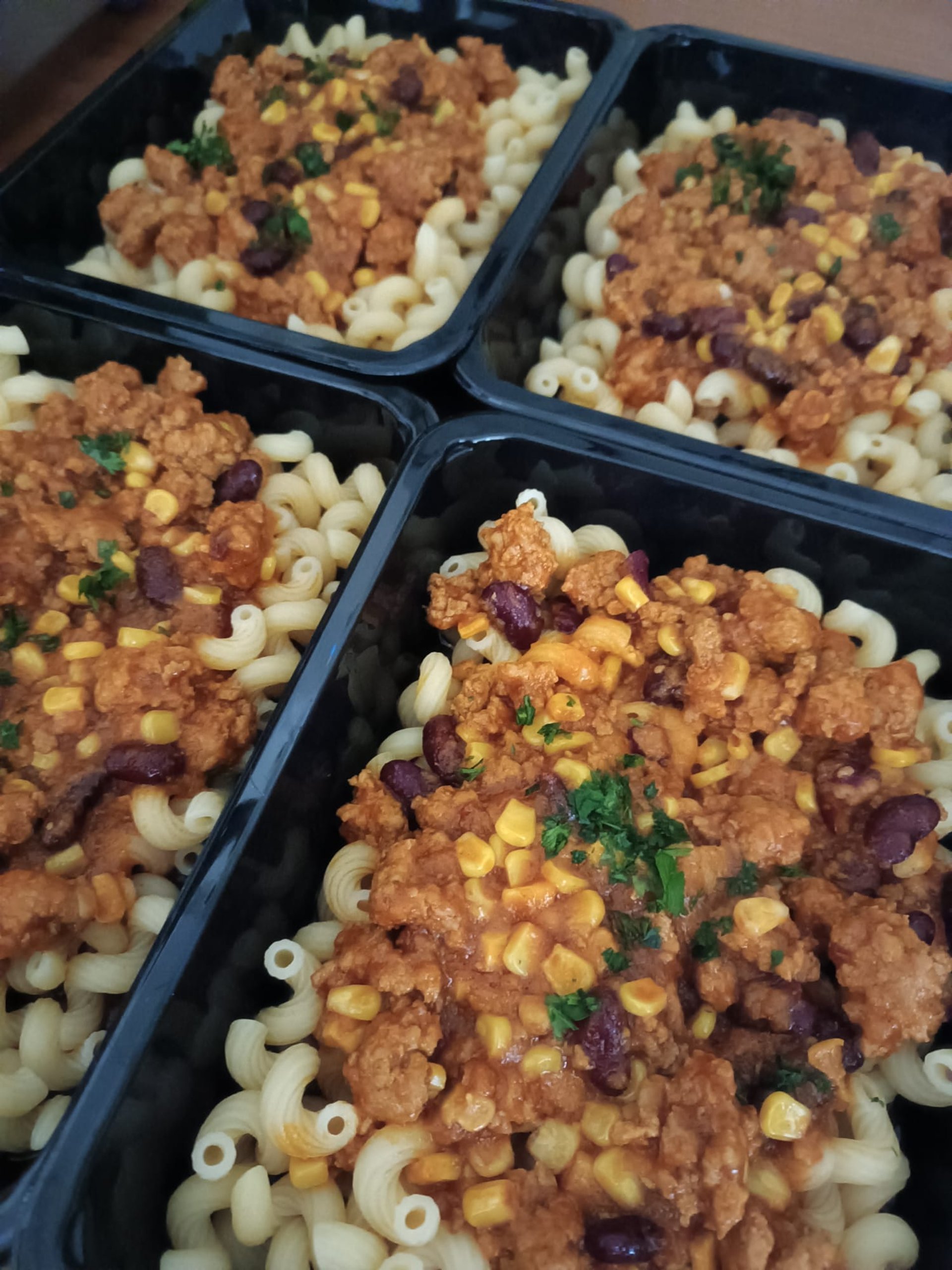 an abstract photo of a curved building with a blue sky in the background