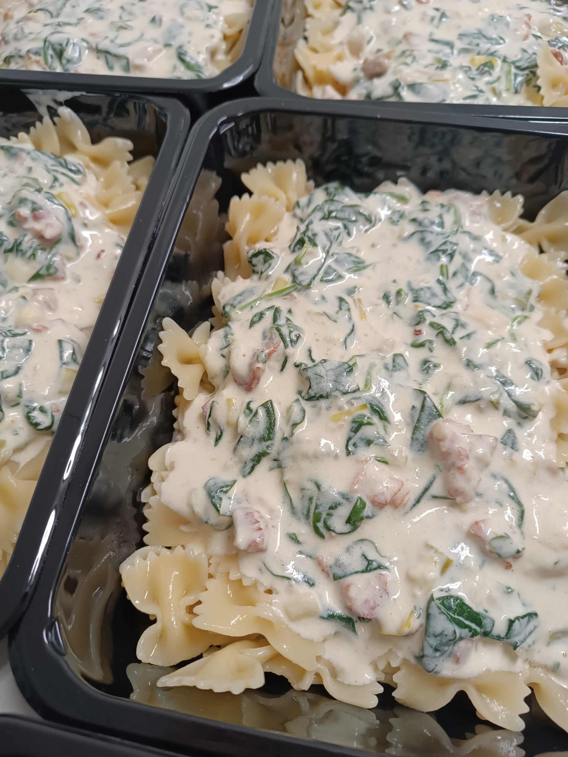 an abstract photo of a curved building with a blue sky in the background