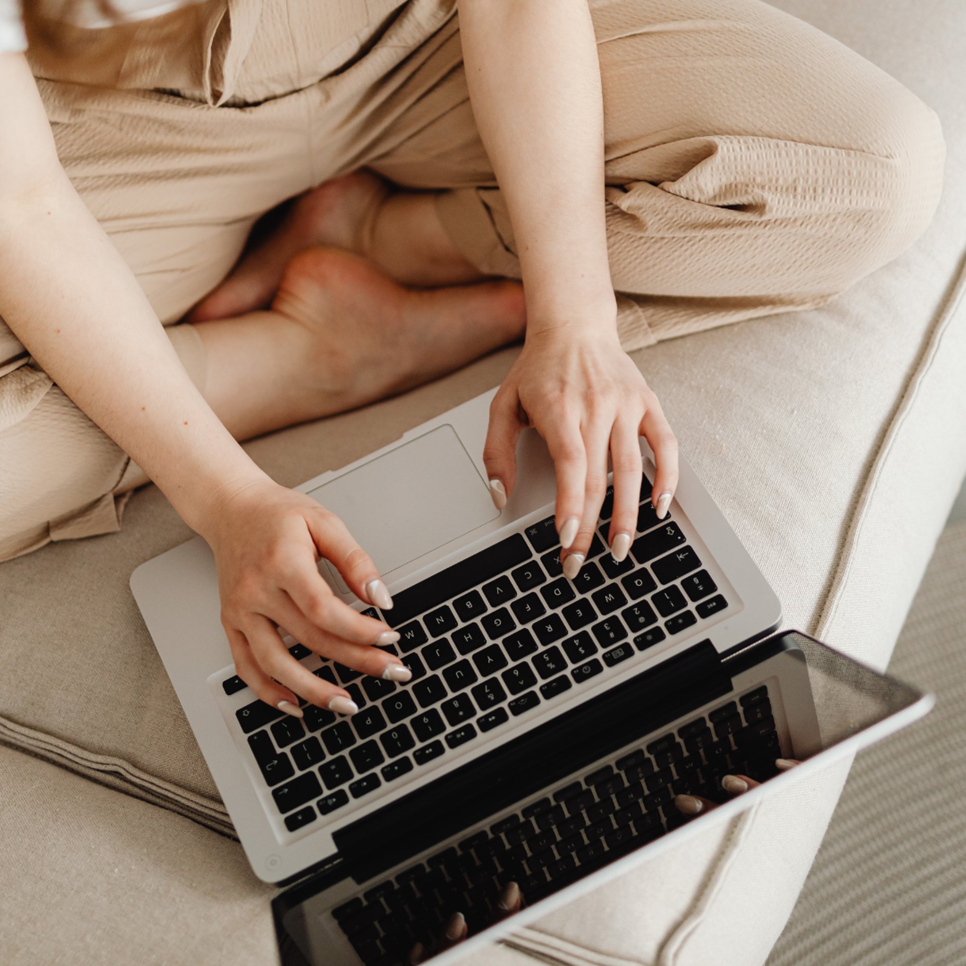 woman wearing yellow long-sleeved dress under white clouds and blue sky during daytime