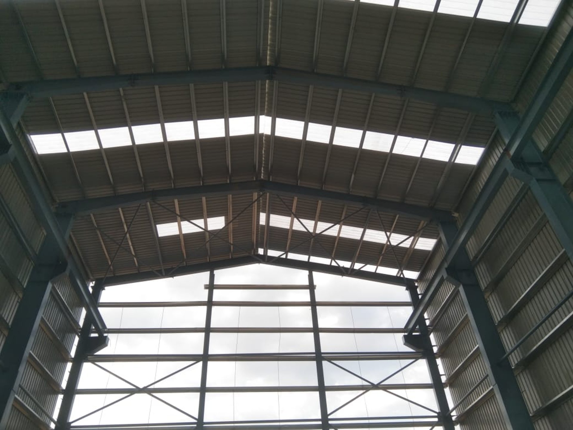 A white canopy provides shade in an open space.