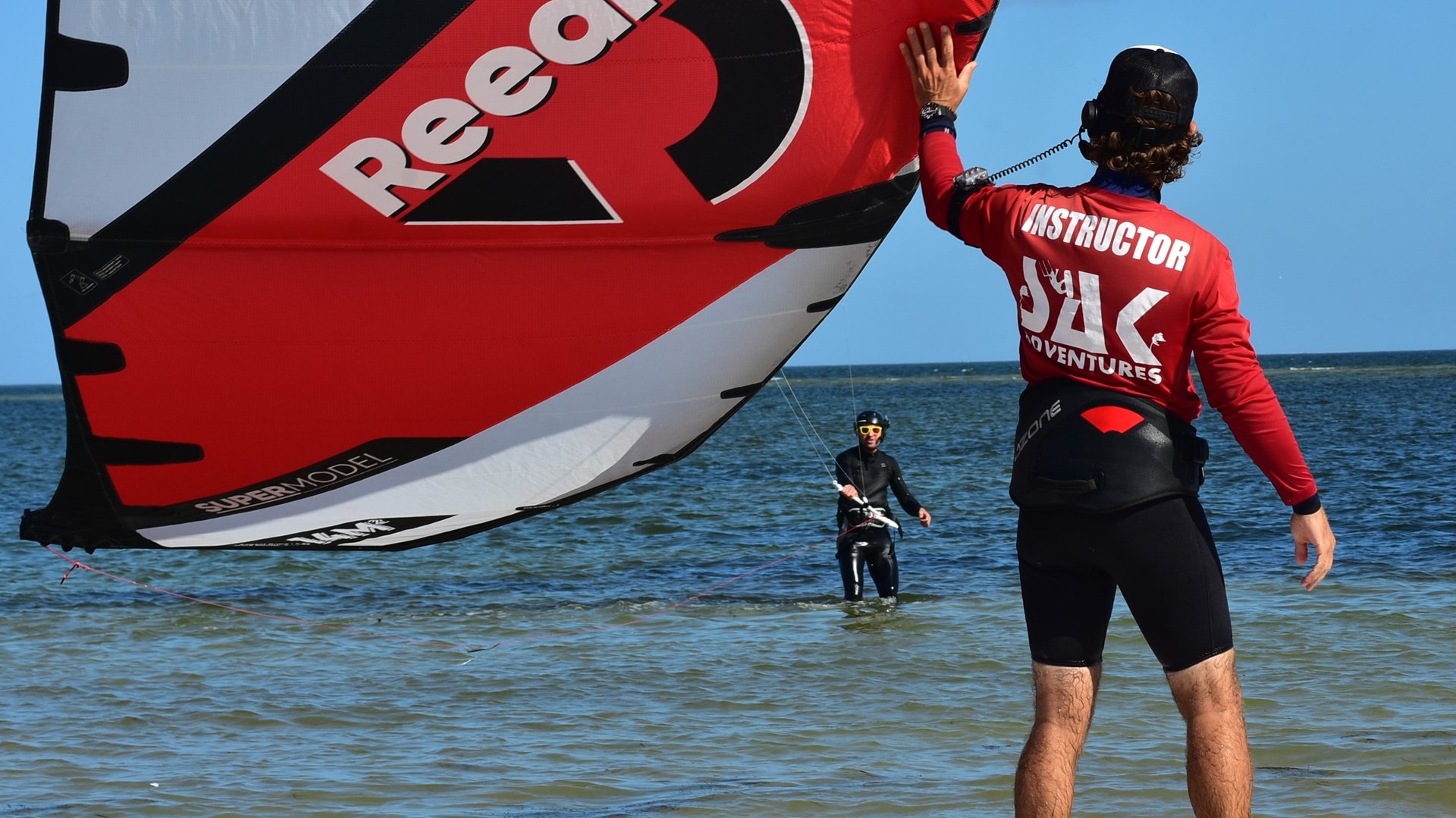 an abstract photo of a curved building with a blue sky in the background