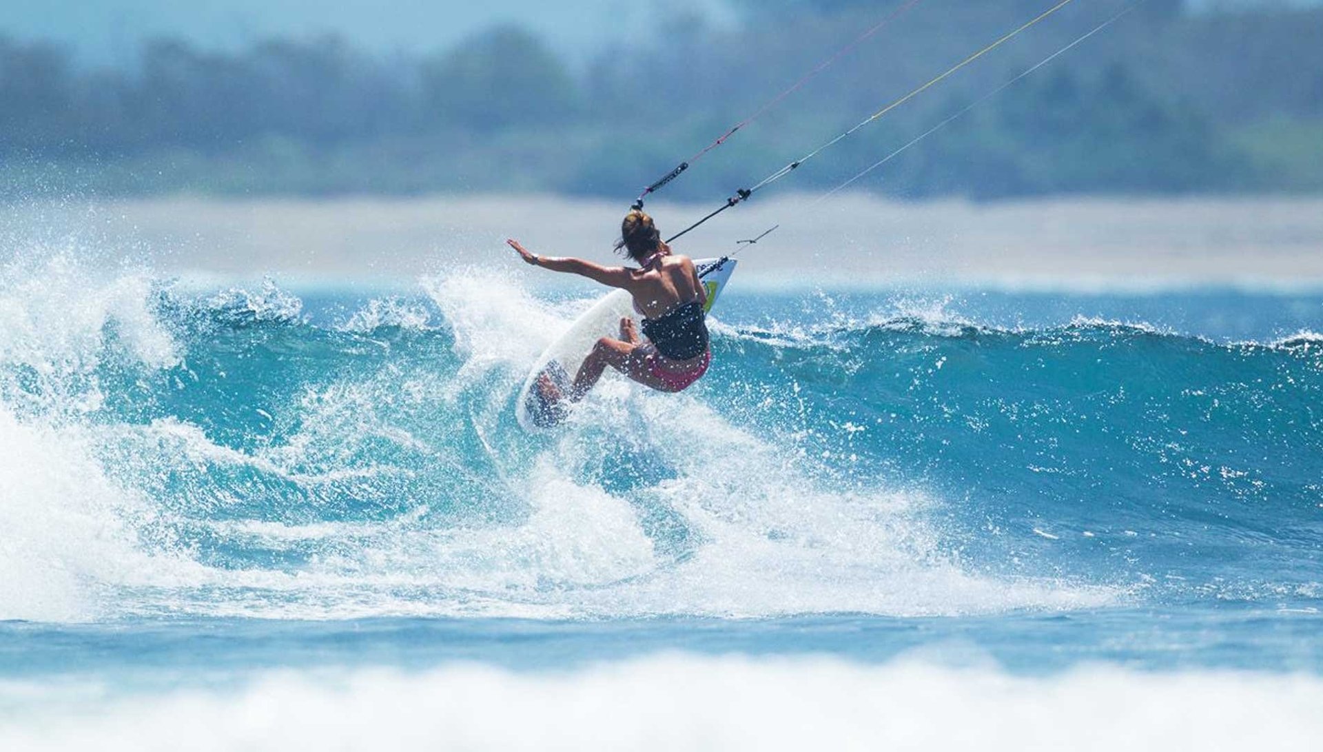 an abstract photo of a curved building with a blue sky in the background