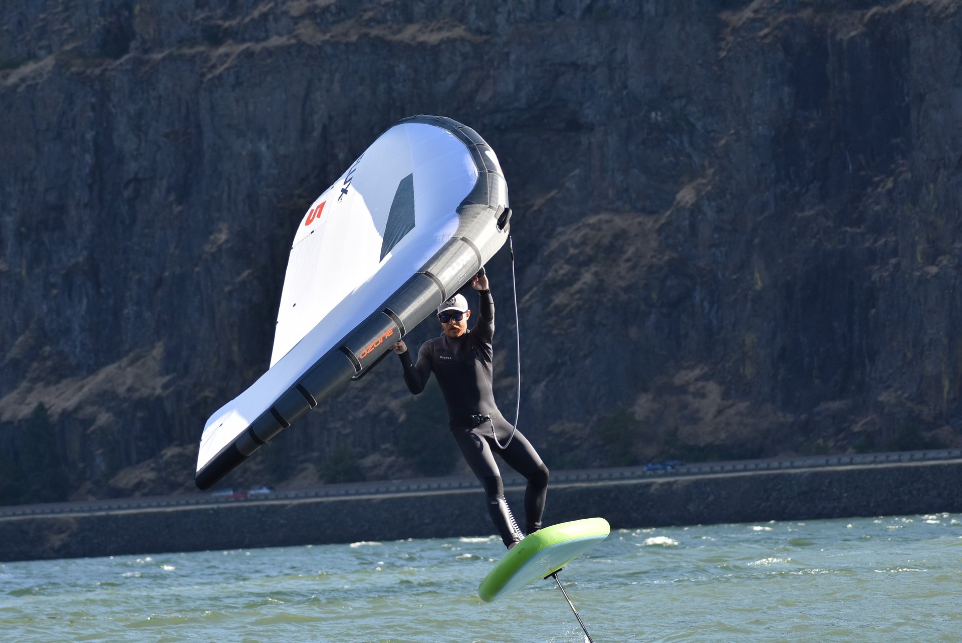 an abstract photo of a curved building with a blue sky in the background