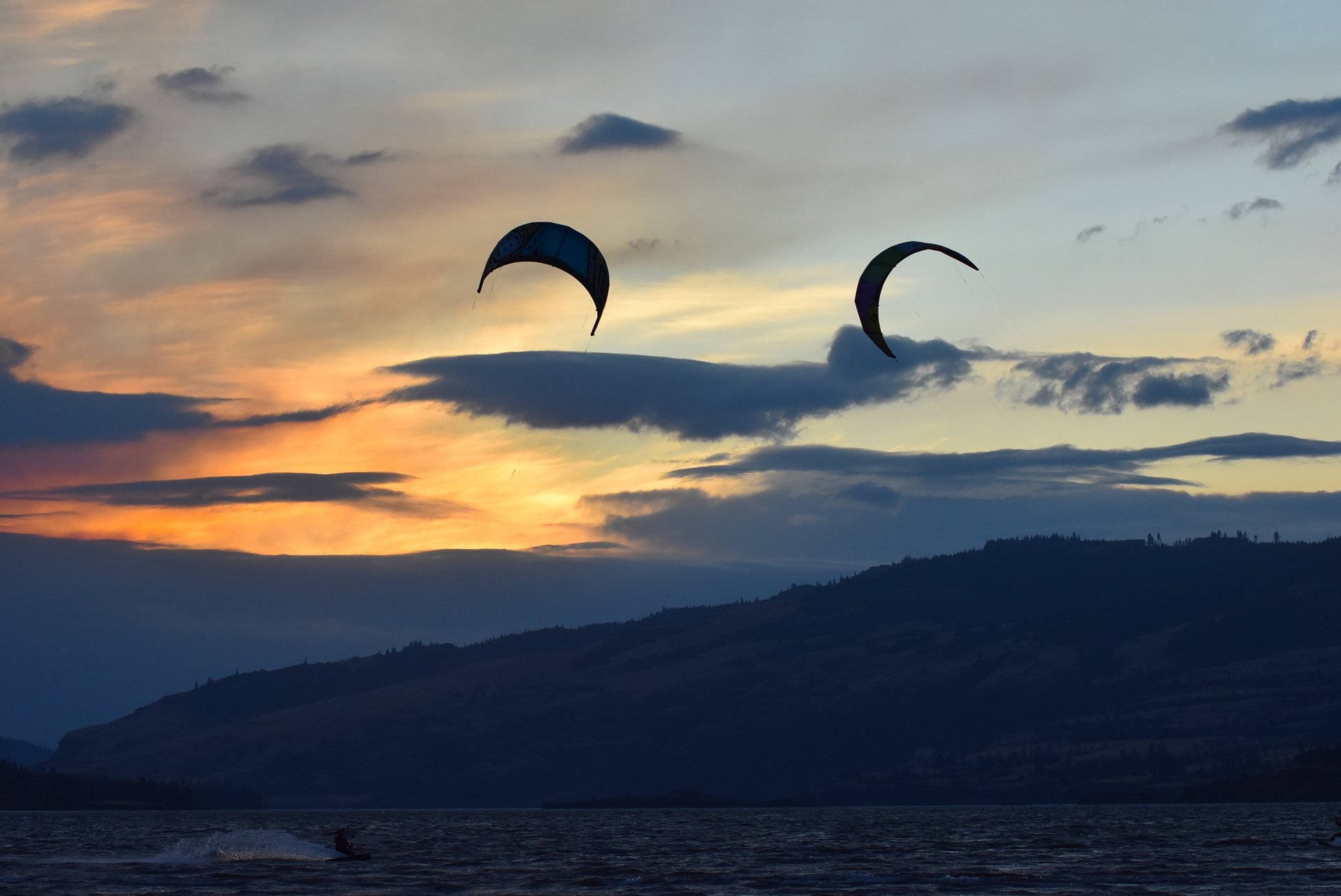 an abstract photo of a curved building with a blue sky in the background