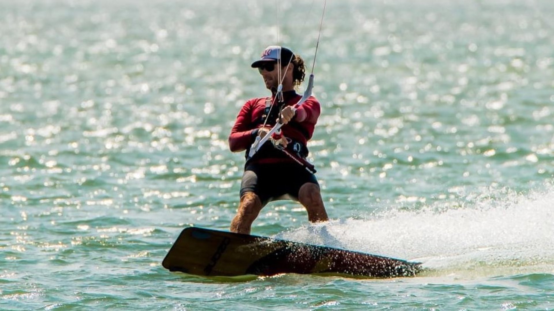an abstract photo of a curved building with a blue sky in the background