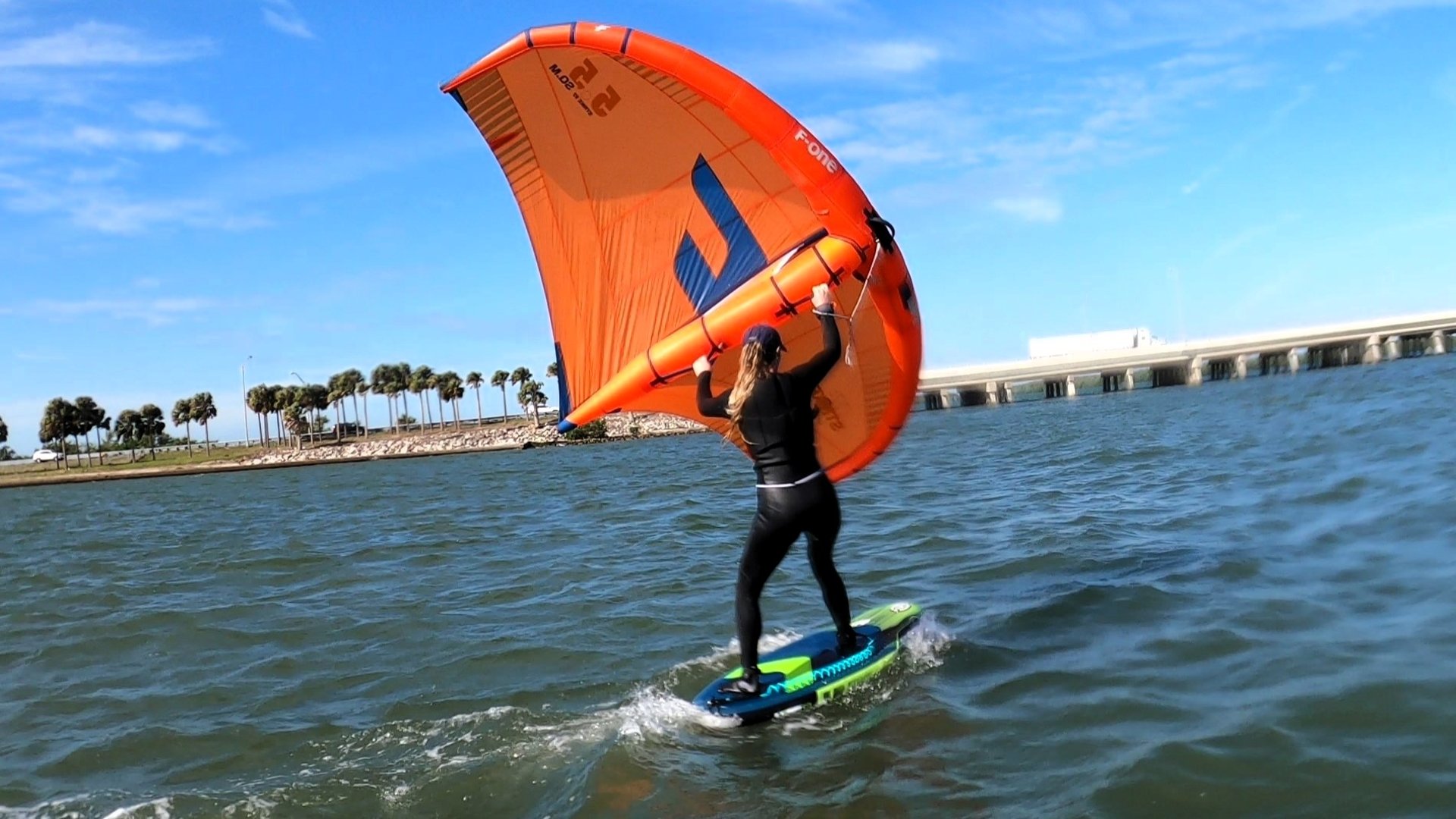 an abstract photo of a curved building with a blue sky in the background