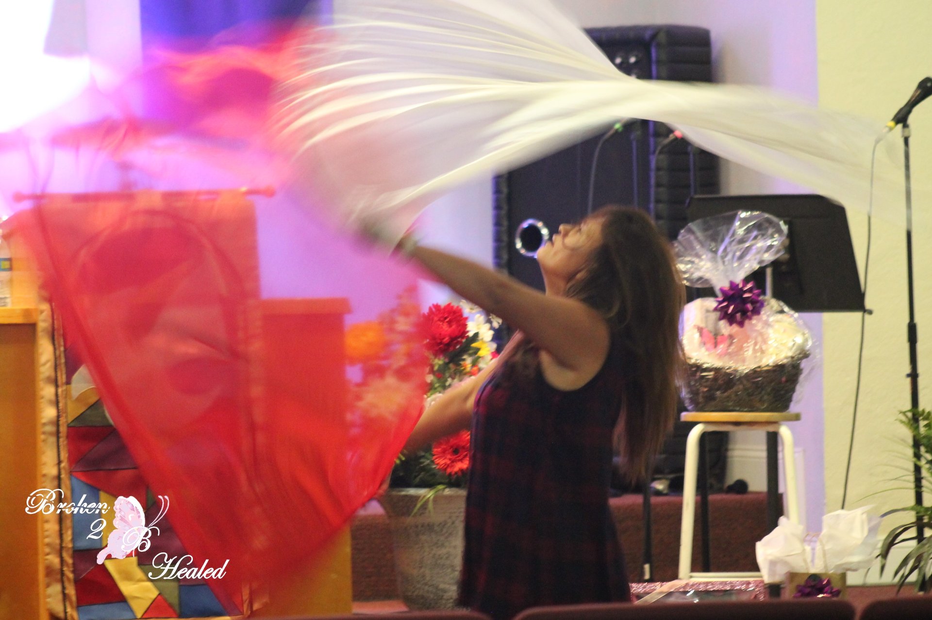 an abstract photo of a curved building with a blue sky in the background