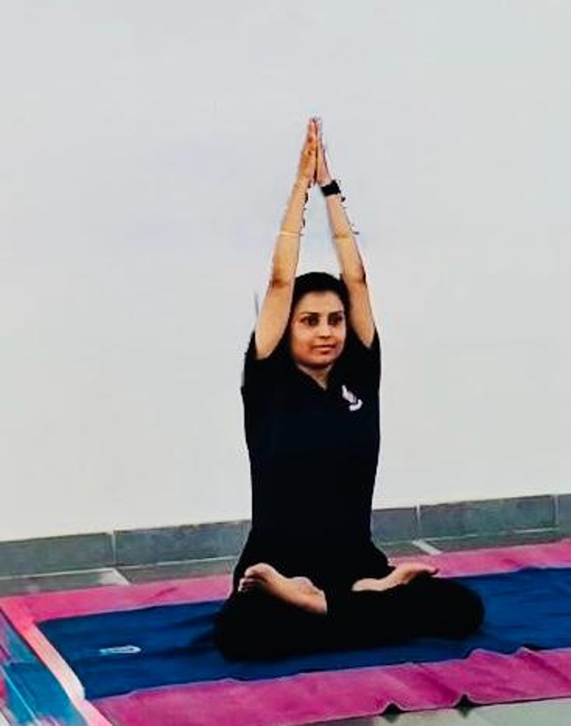 a large room with a lot of yoga mats on the floor