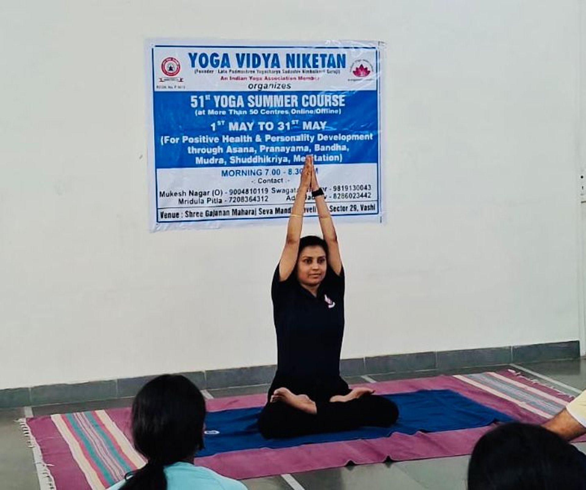 a large room with a lot of yoga mats on the floor