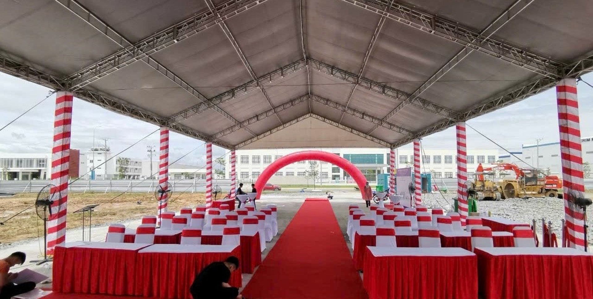 an abstract photo of a curved building with a blue sky in the background