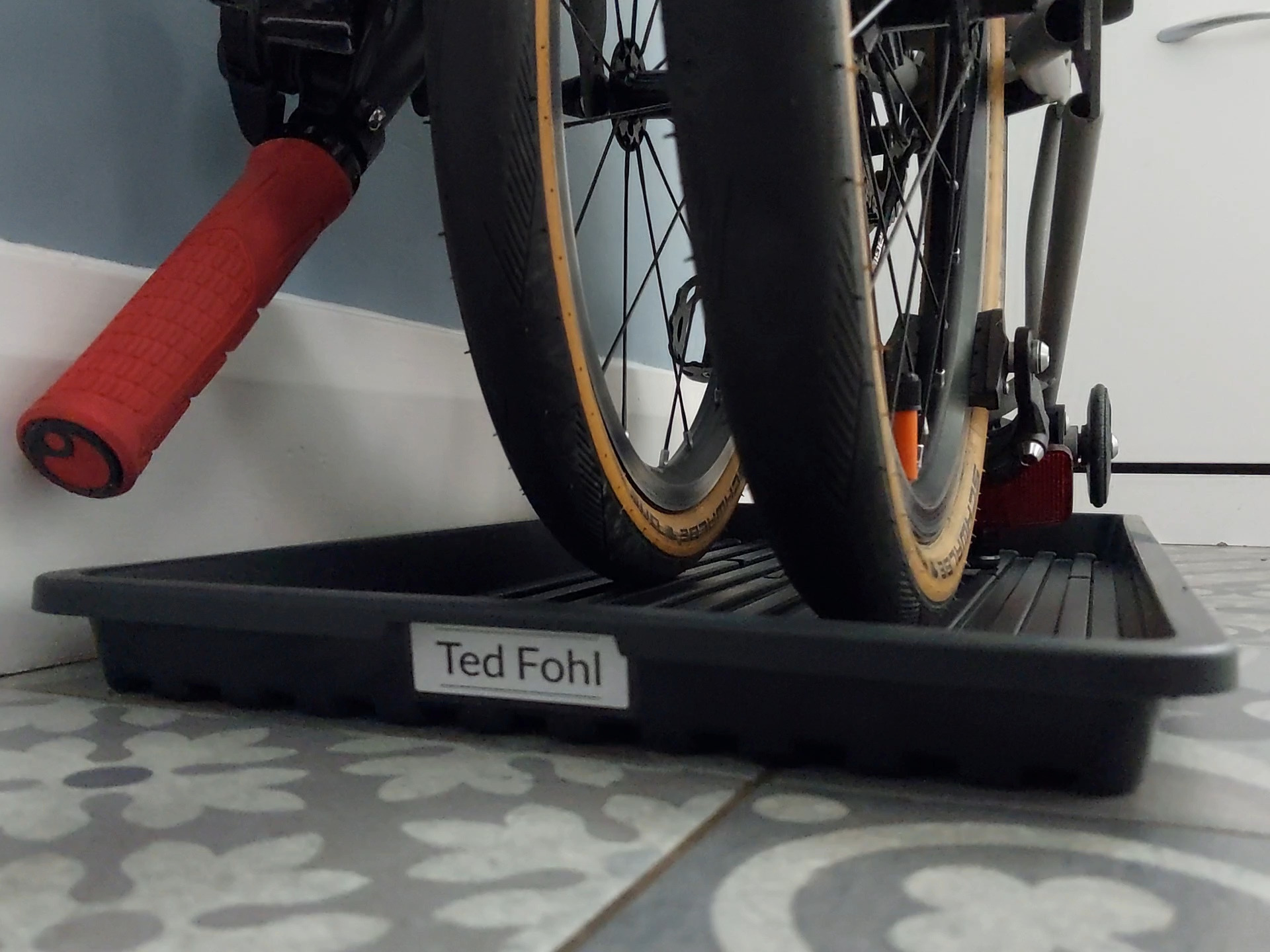 a bicycle parked on a sidewalk