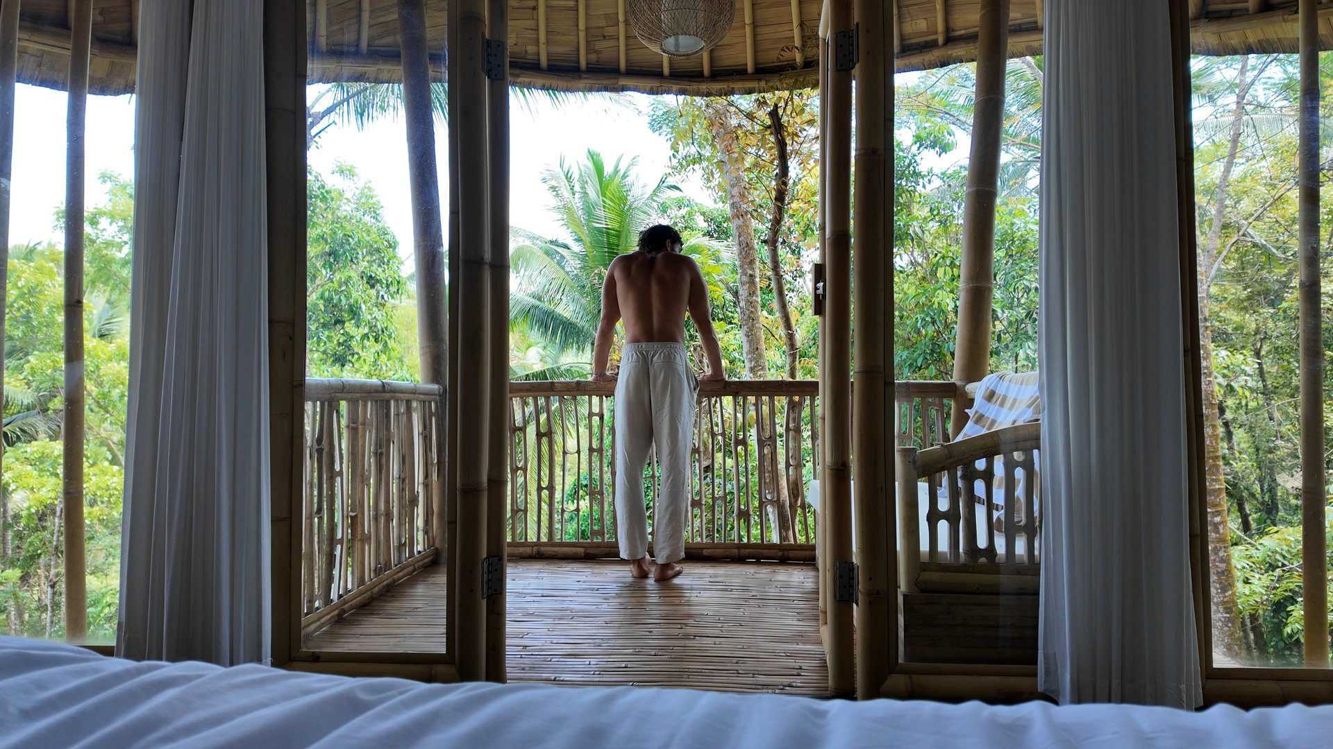 an abstract photo of a curved building with a blue sky in the background