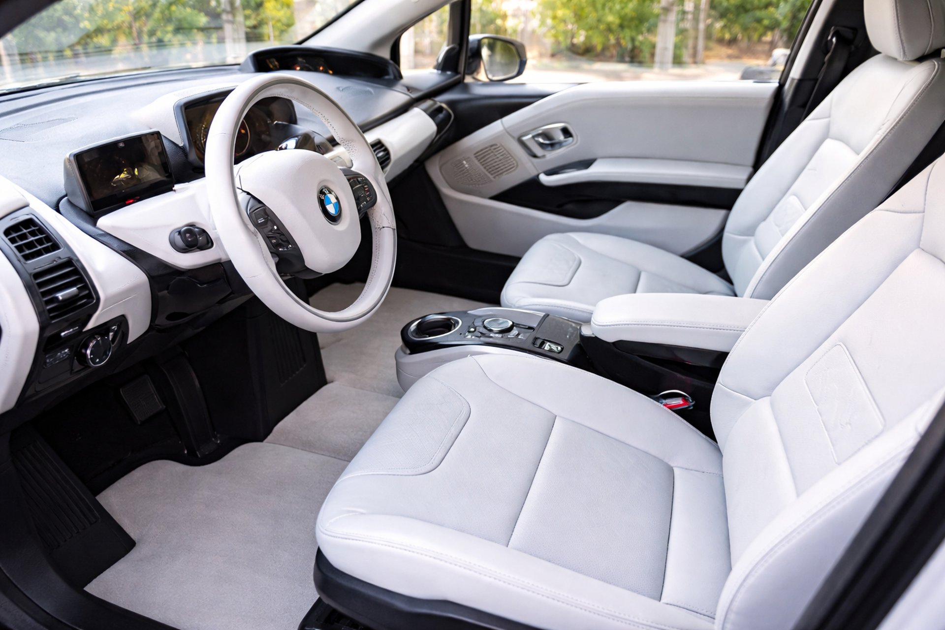 a cat sleeping on a couch with its eyes closed