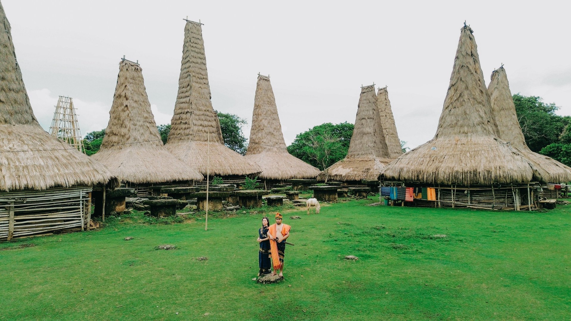 woman wearing yellow long-sleeved dress under white clouds and blue sky during daytime