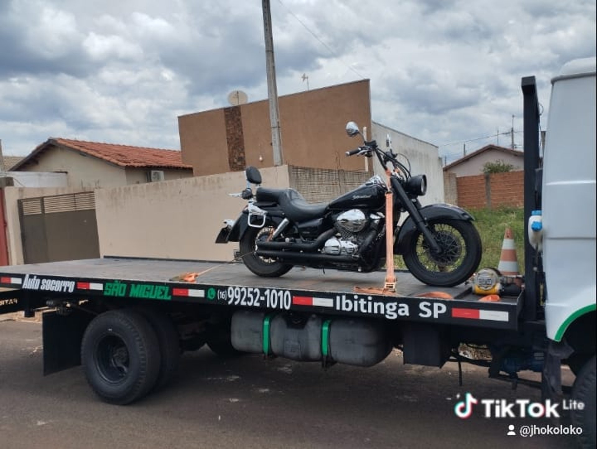 woman wearing yellow long-sleeved dress under white clouds and blue sky during daytime