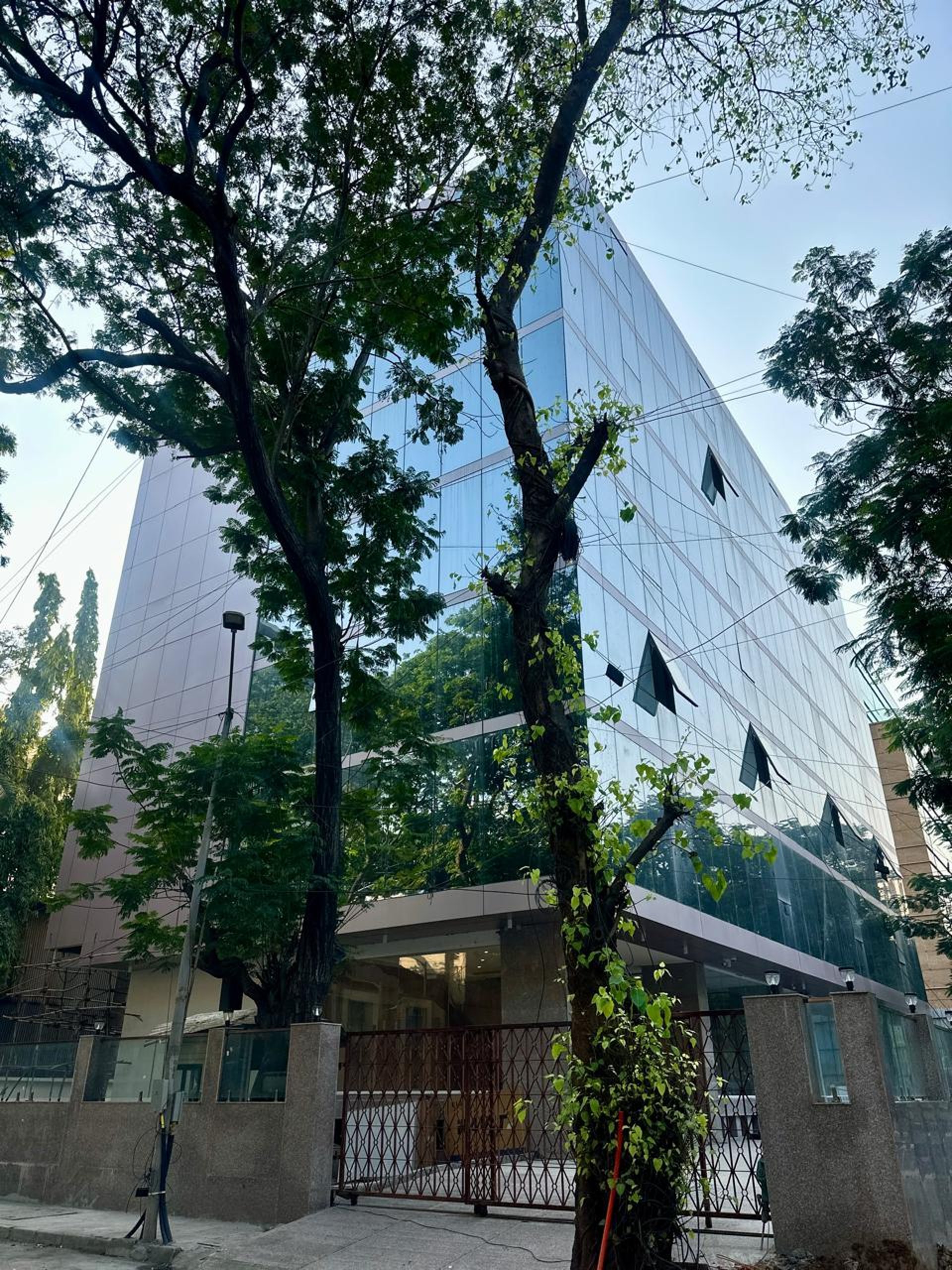 an abstract photo of a curved building with a blue sky in the background