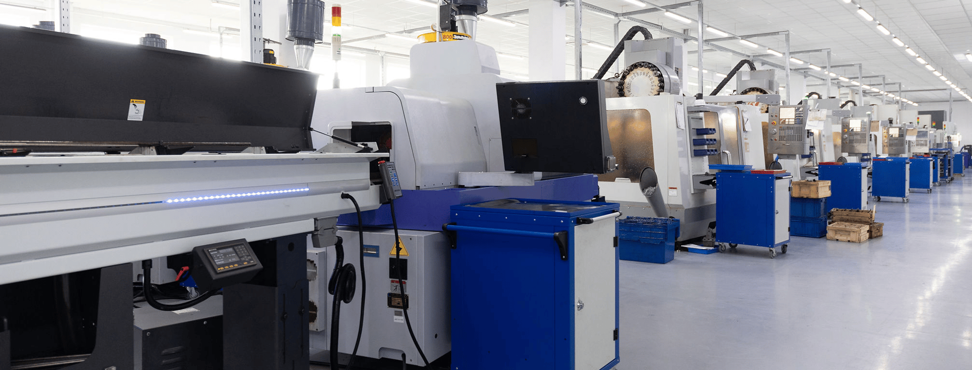 an abstract photo of a curved building with a blue sky in the background