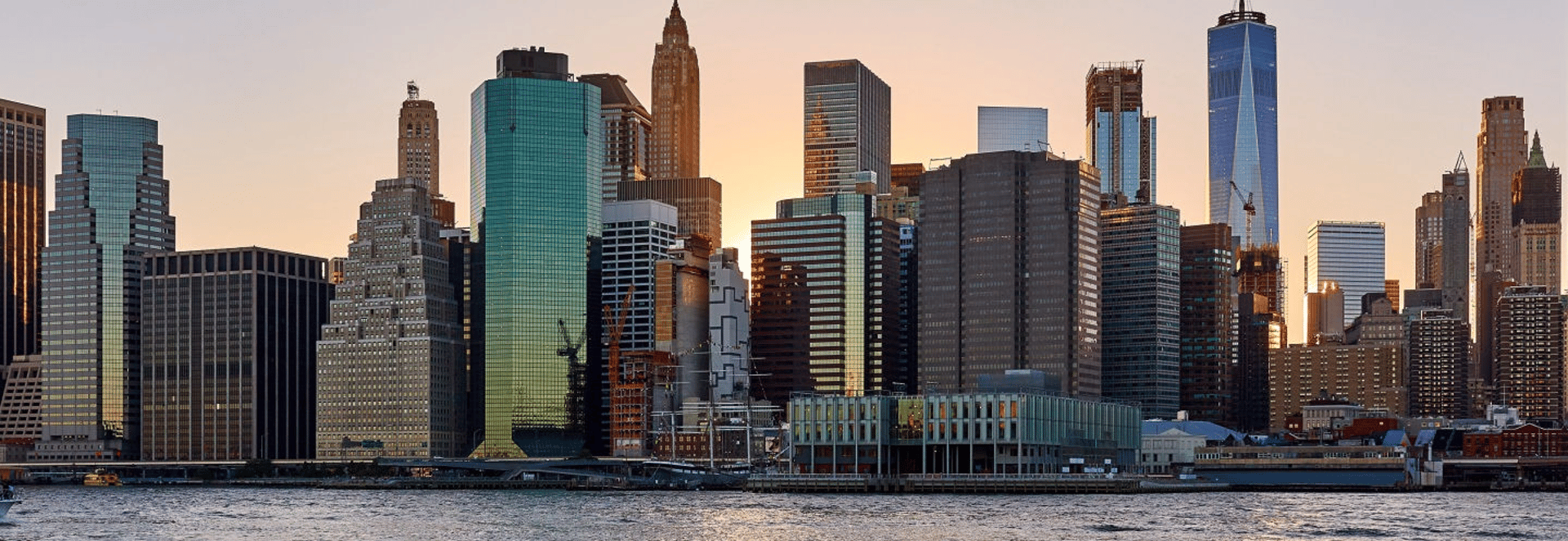 an abstract photo of a curved building with a blue sky in the background