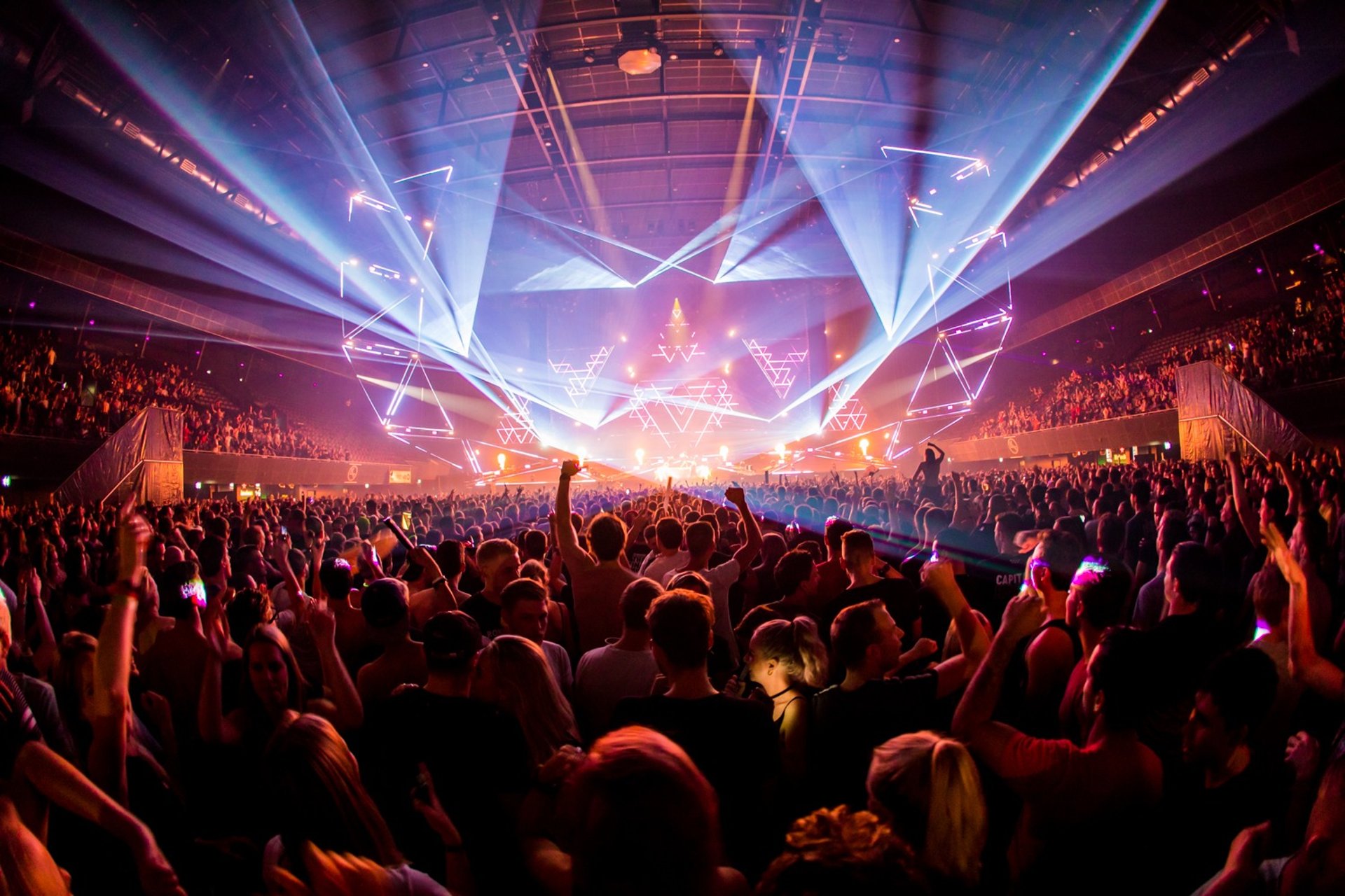 an abstract photo of a curved building with a blue sky in the background