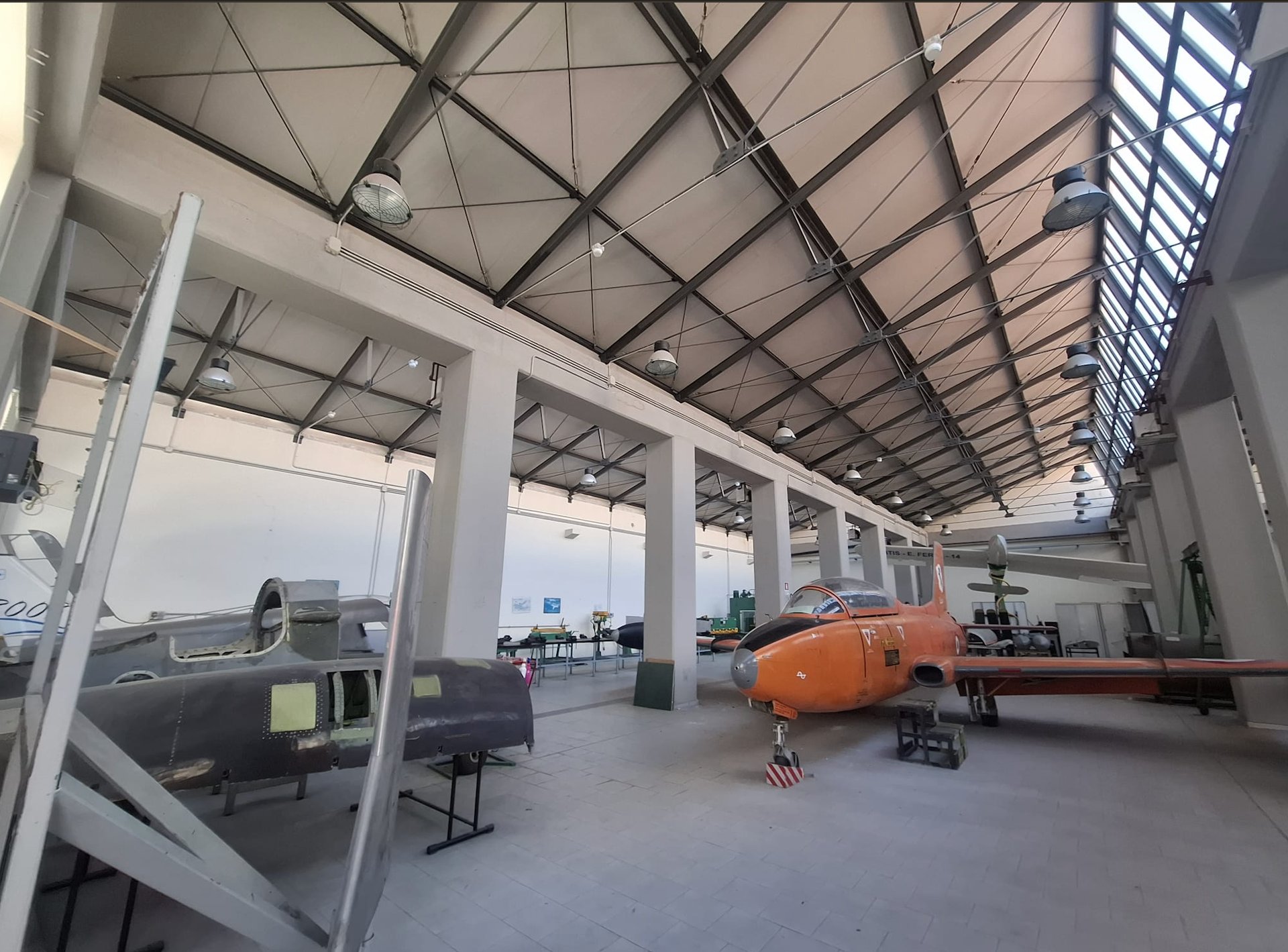 an abstract photo of a curved building with a blue sky in the background
