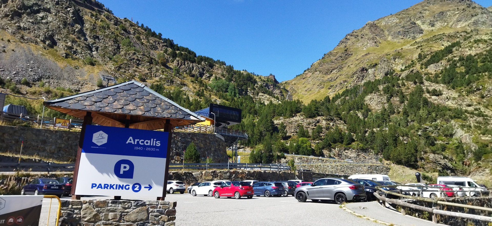 woman wearing yellow long-sleeved dress under white clouds and blue sky during daytime