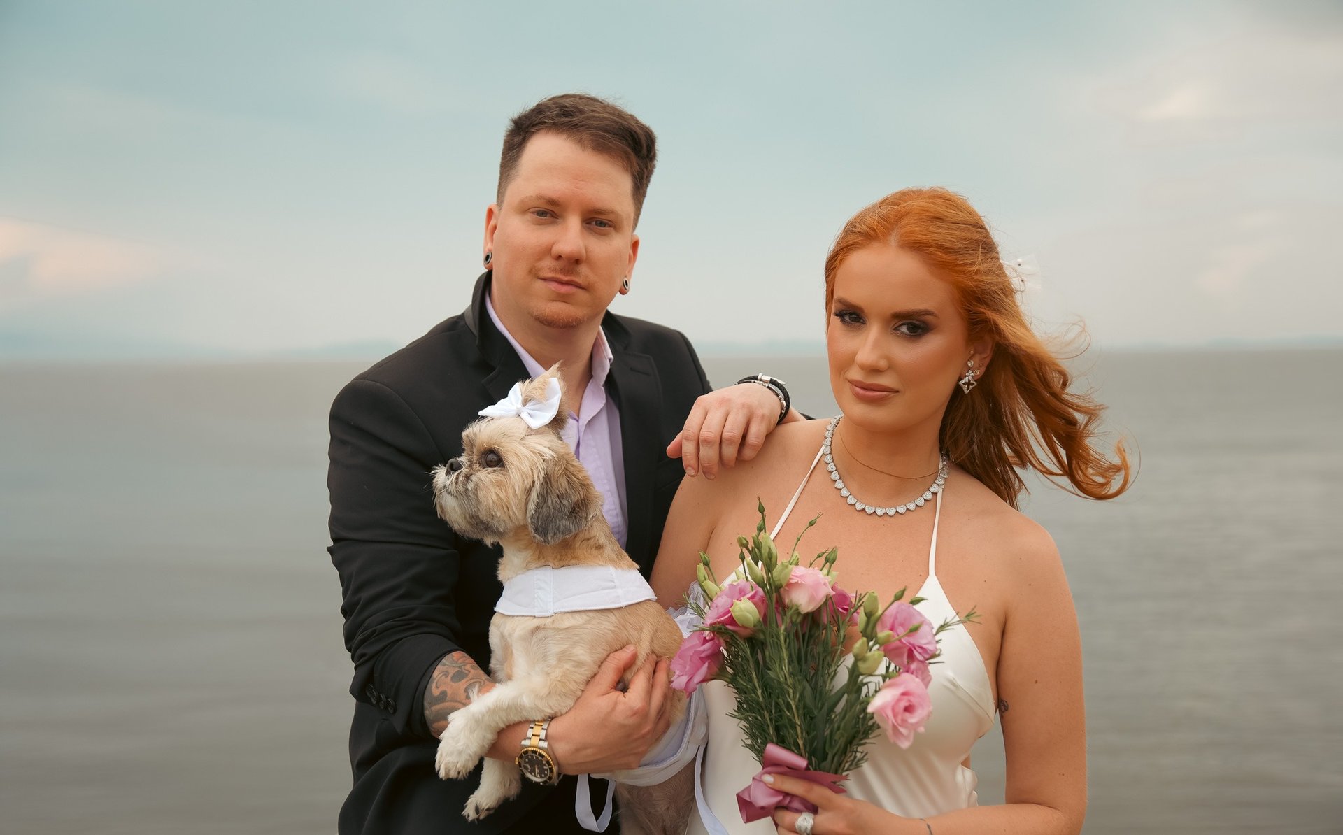 couple wearing silver-colored rings