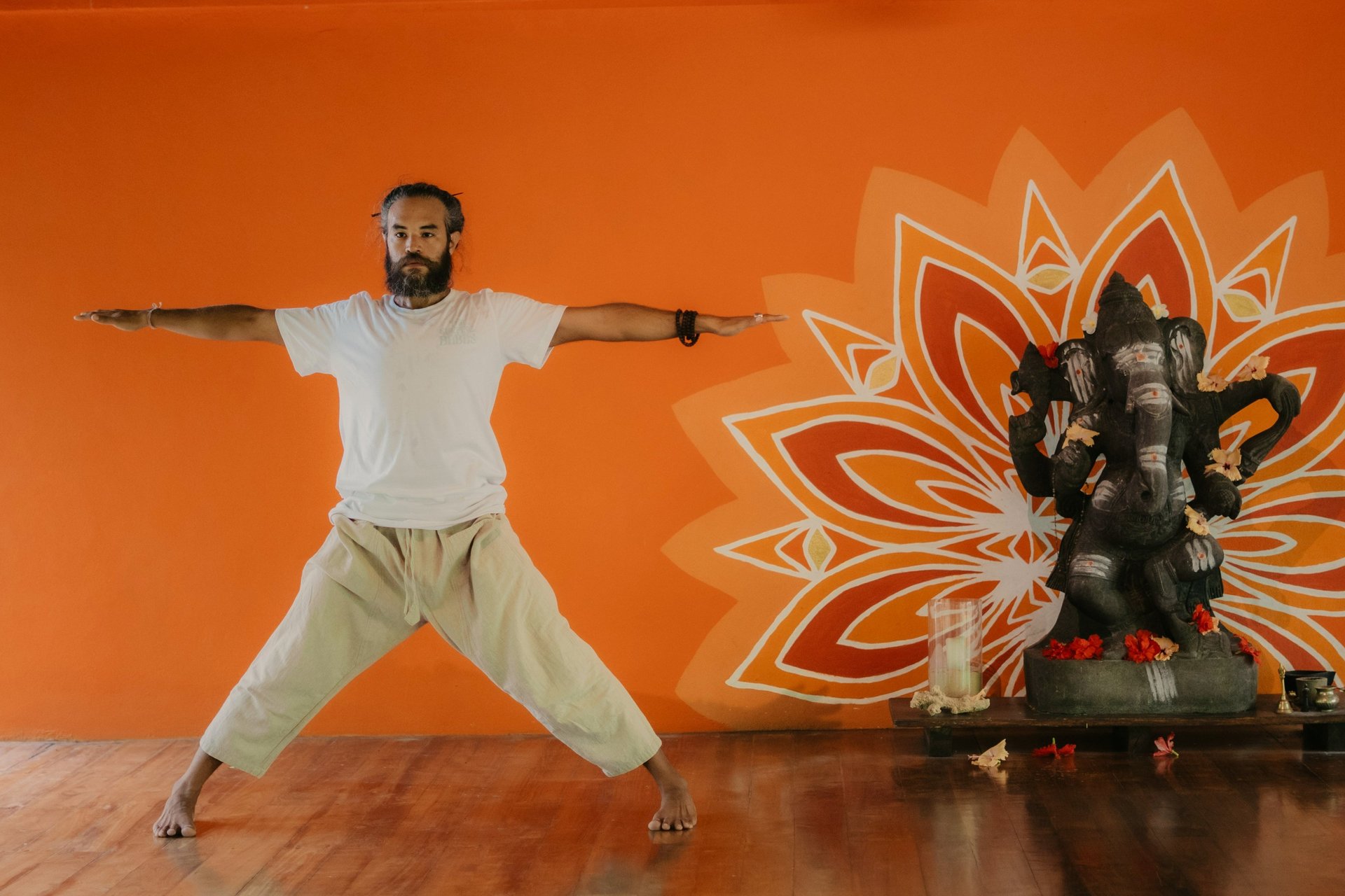 man wearing orange robe meditate
