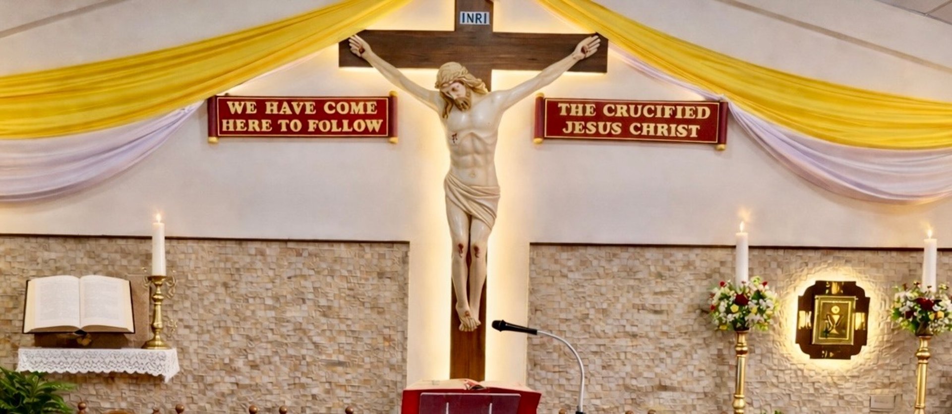 an abstract photo of a curved building with a blue sky in the background