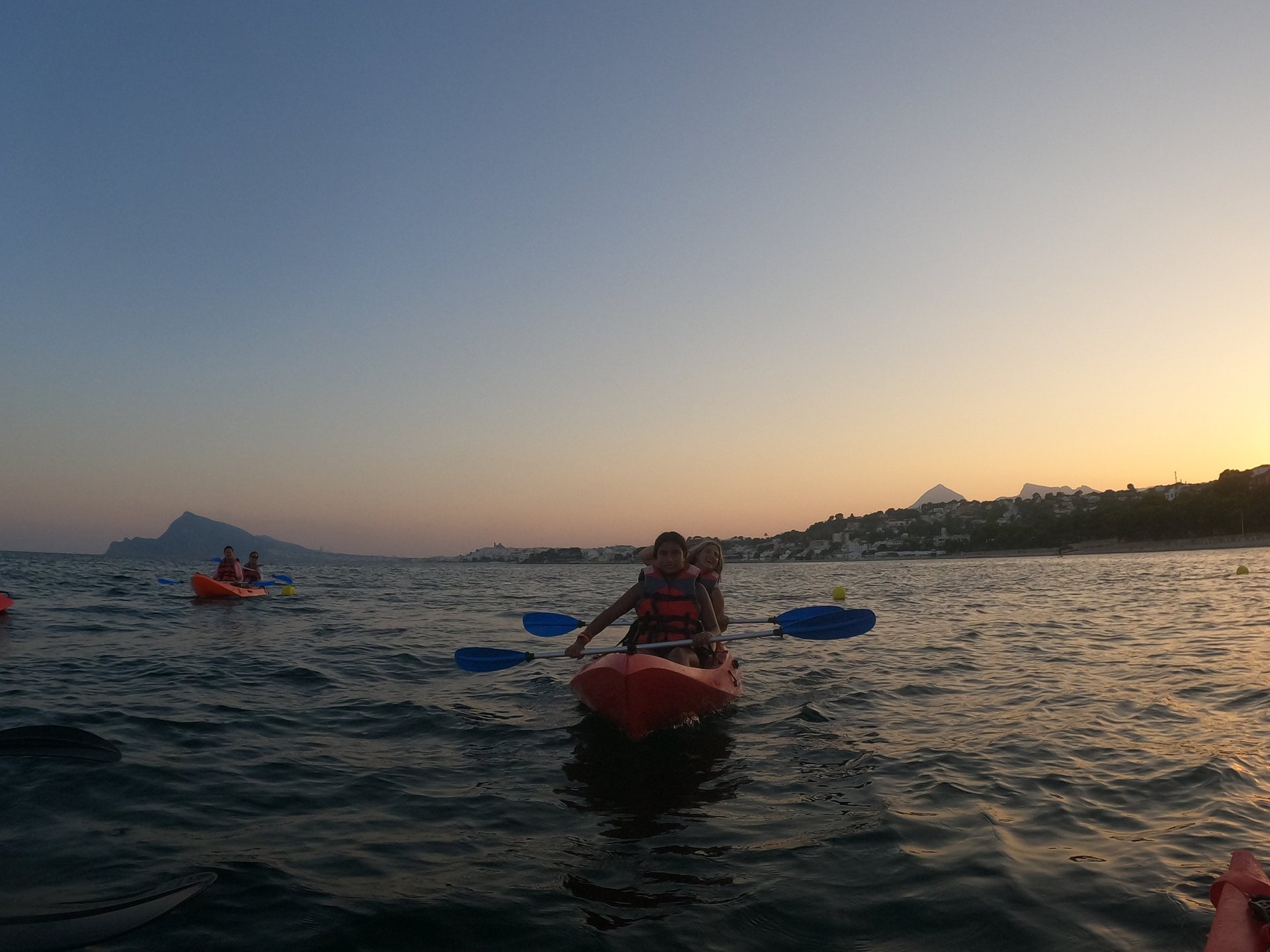 woman wearing yellow long-sleeved dress under white clouds and blue sky during daytime