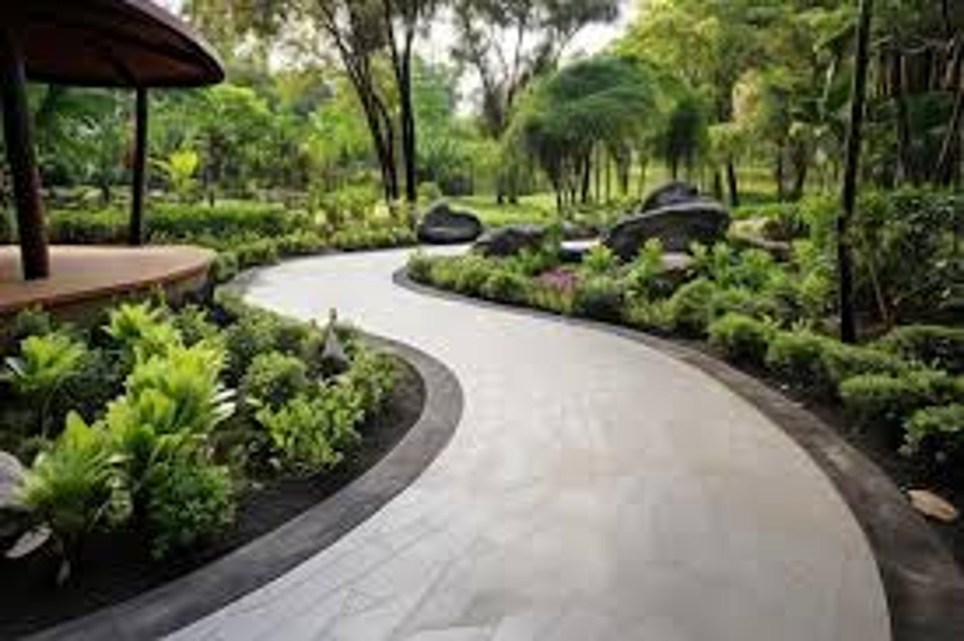 an abstract photo of a curved building with a blue sky in the background